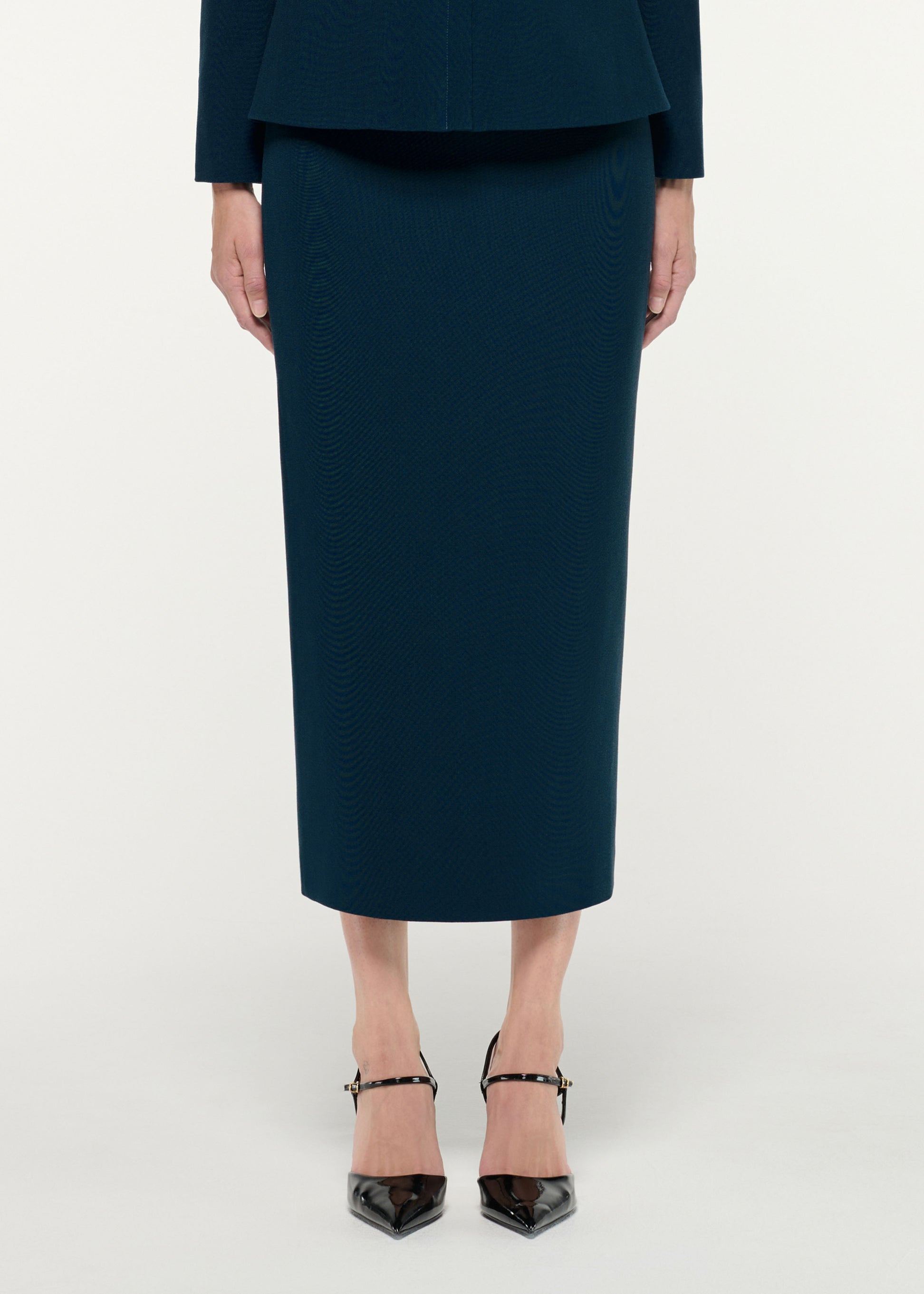 Close up of a model wearing the Crepe Midi Skirt