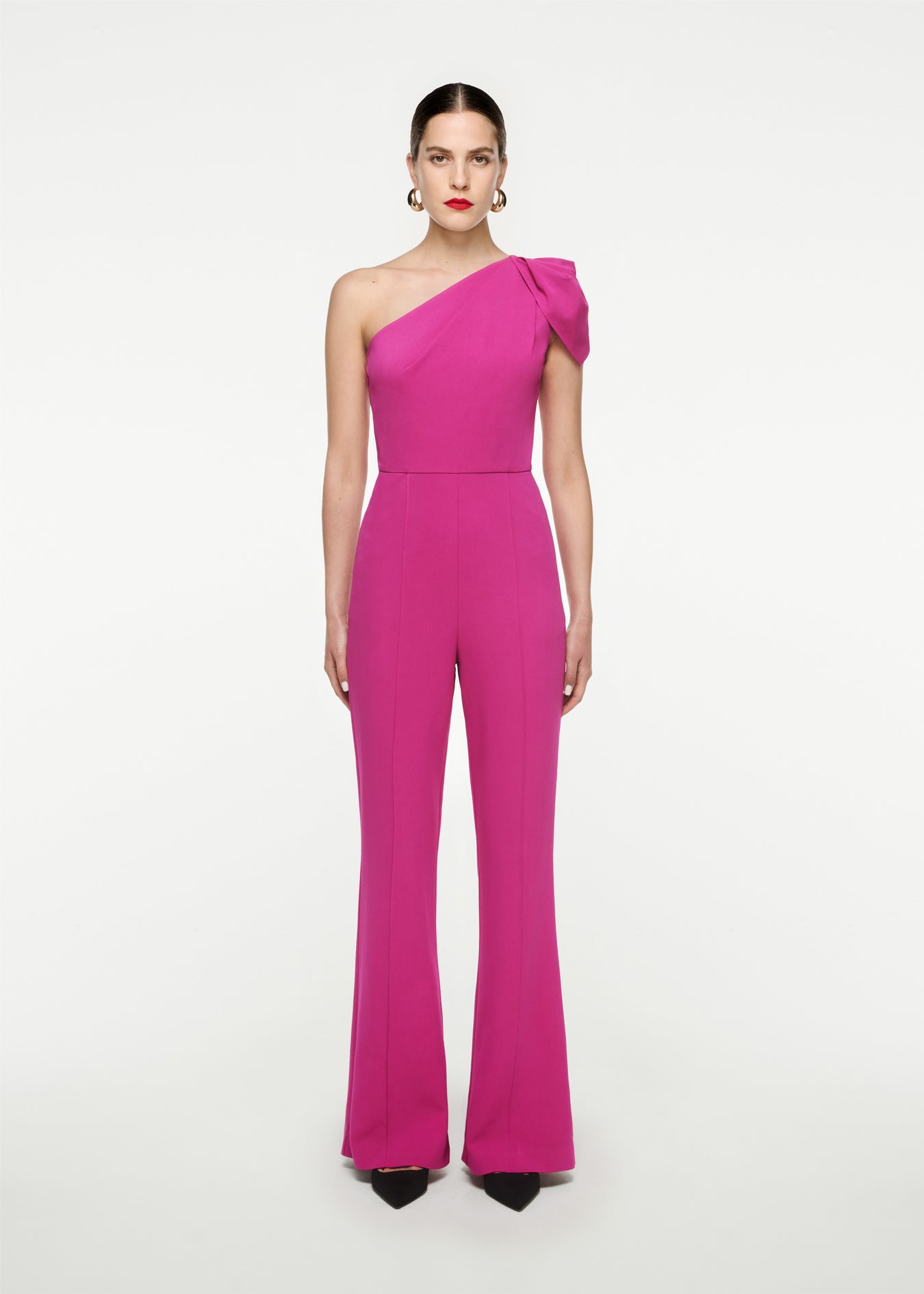 Woman wearing the Asymmetric Stretch Cady Jumpsuit in 