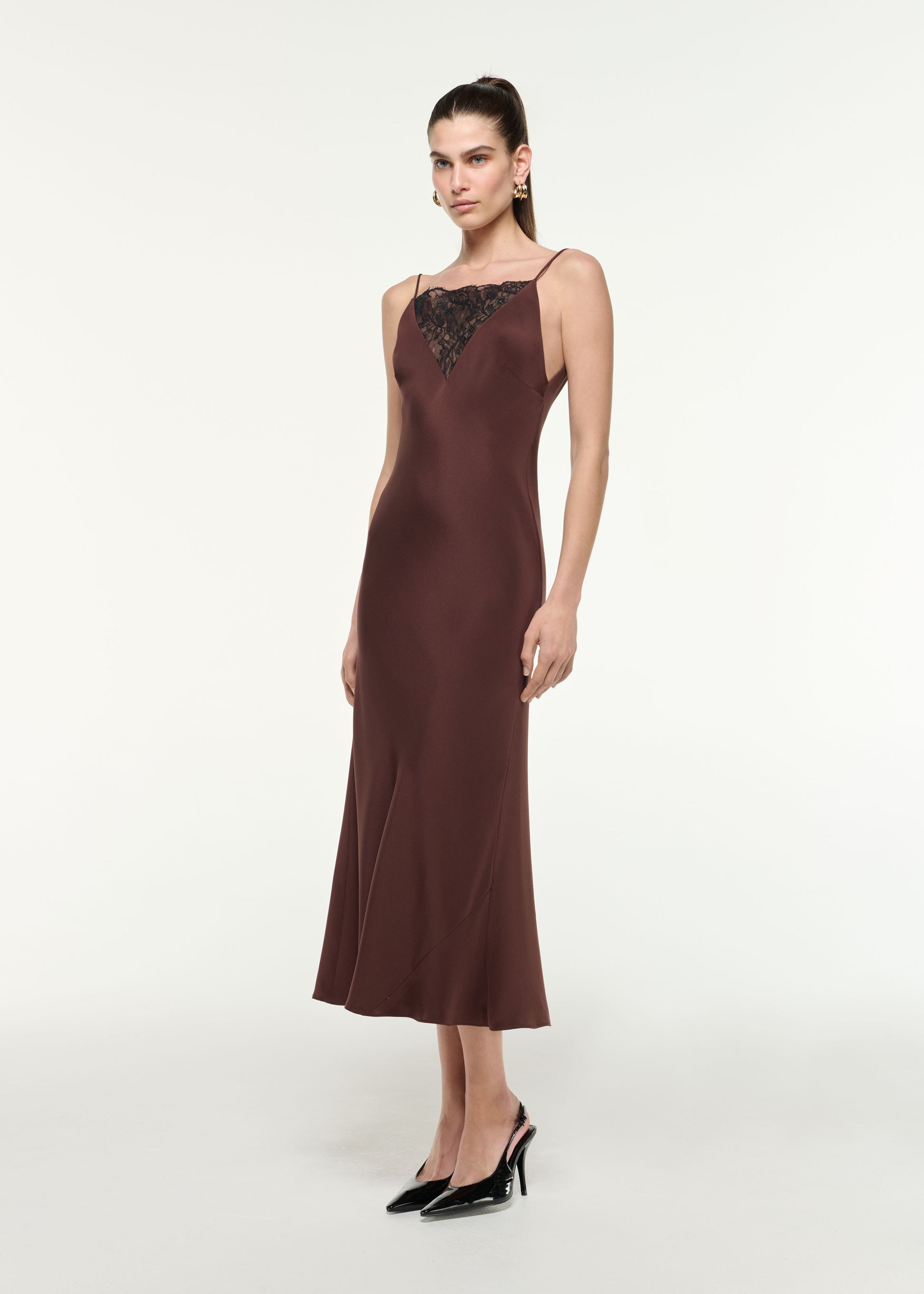 Side view of a model wearing the Silk Lace Midi Dress in Brown