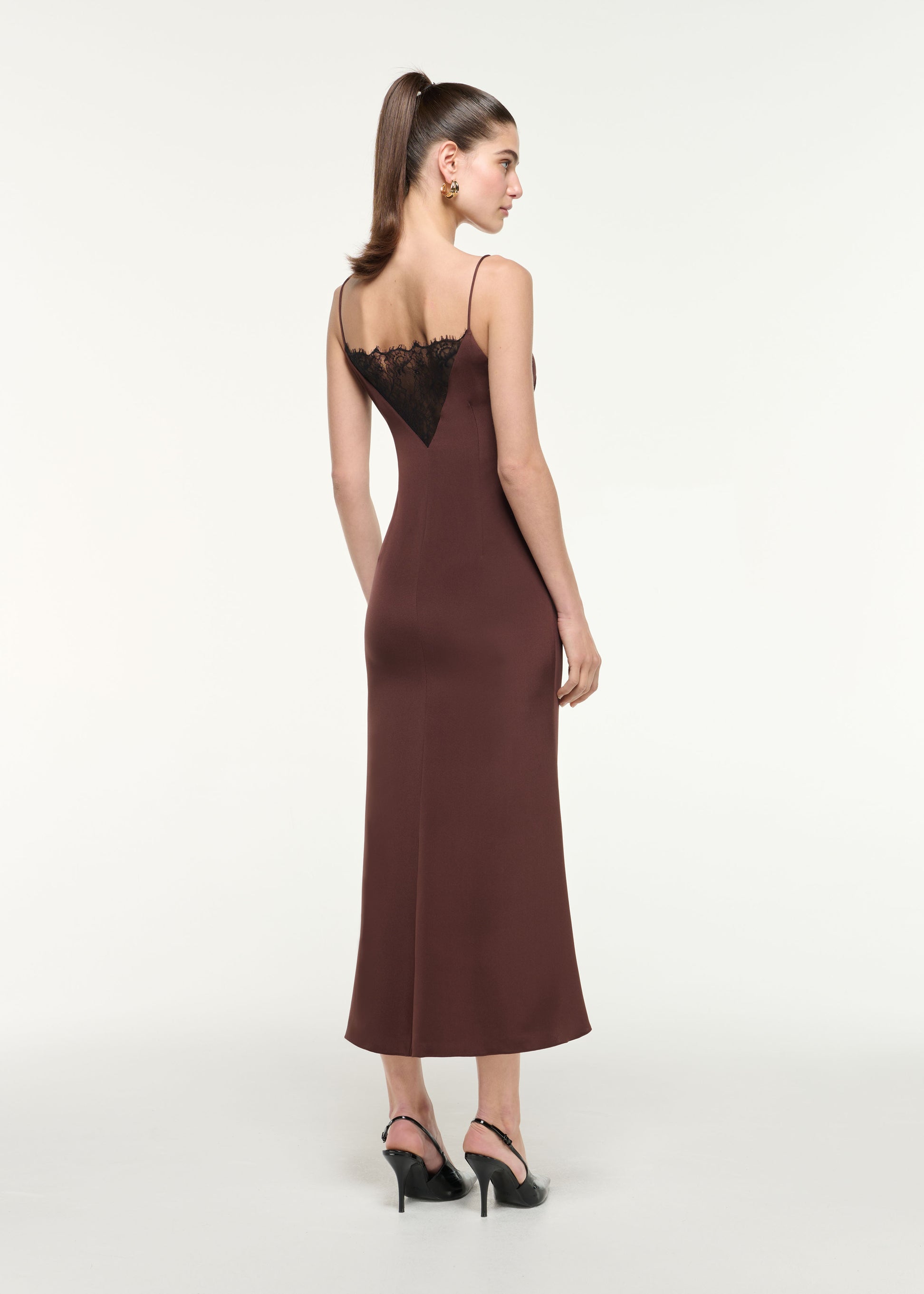 Back view of a model wearing the Silk Lace Midi Dress in Brown