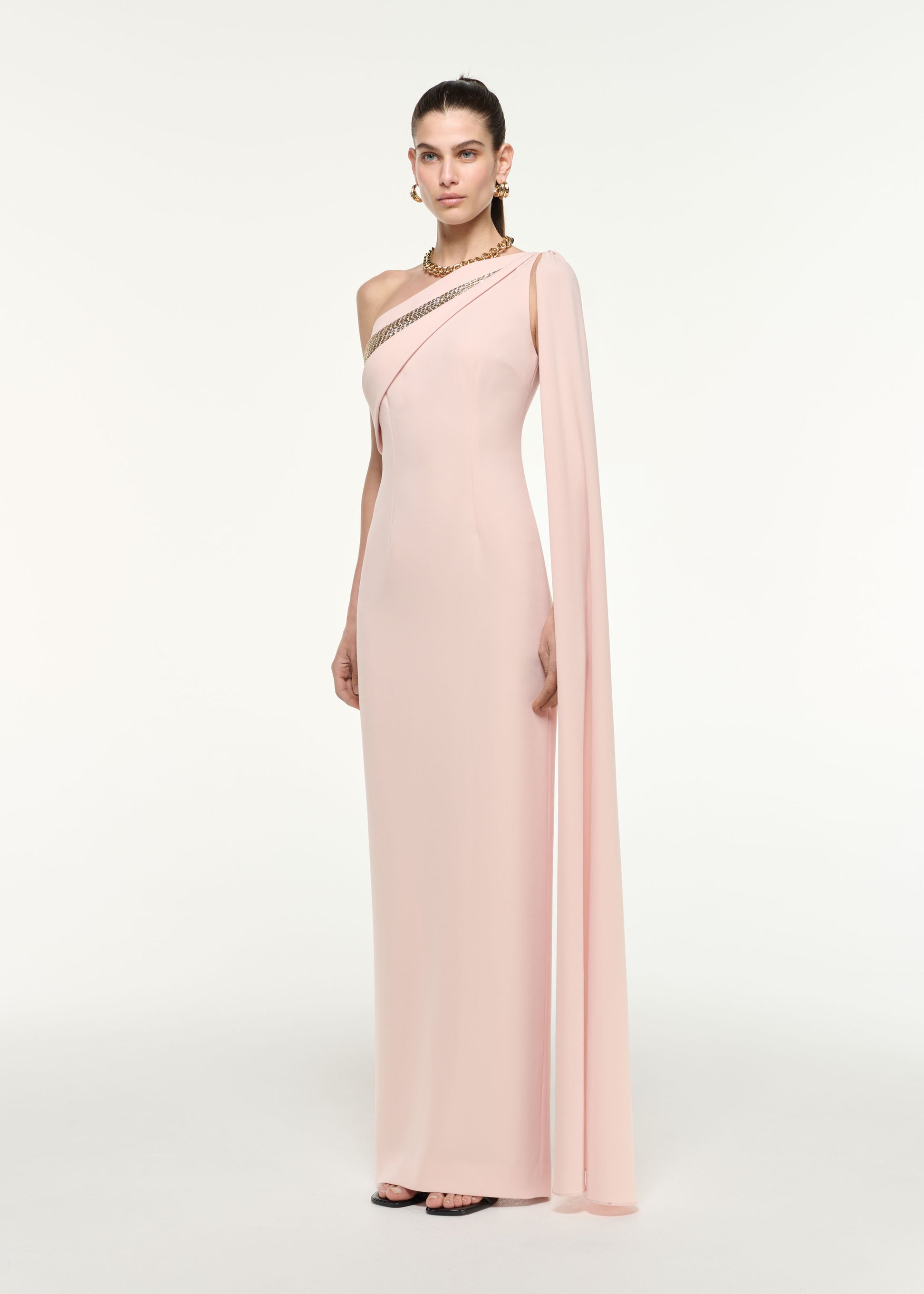 Side view of a model wearing the One Shoulder Diamante Gown in Nude