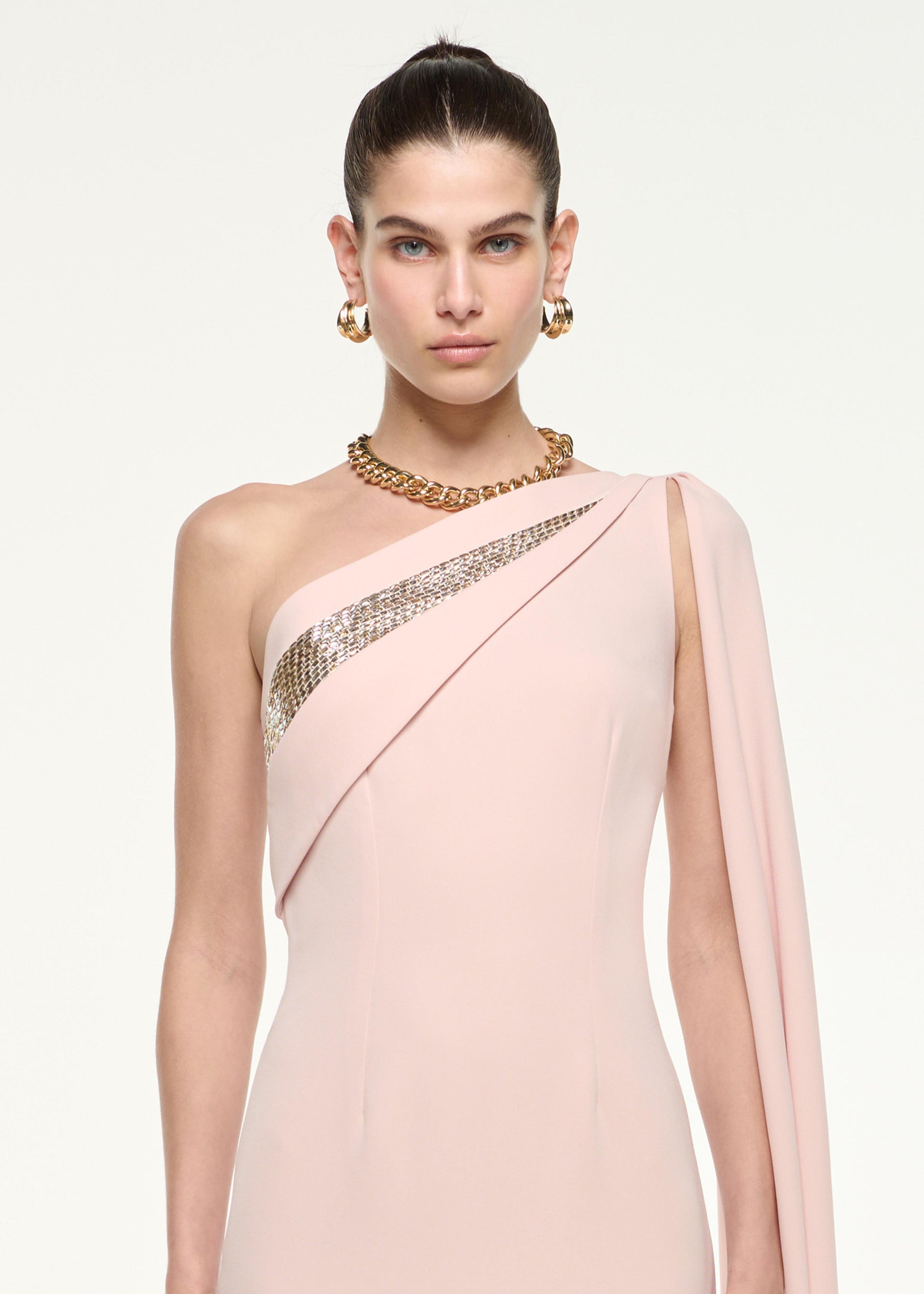 Close up of a model wearing the One Shoulder Diamante Gown in Nude