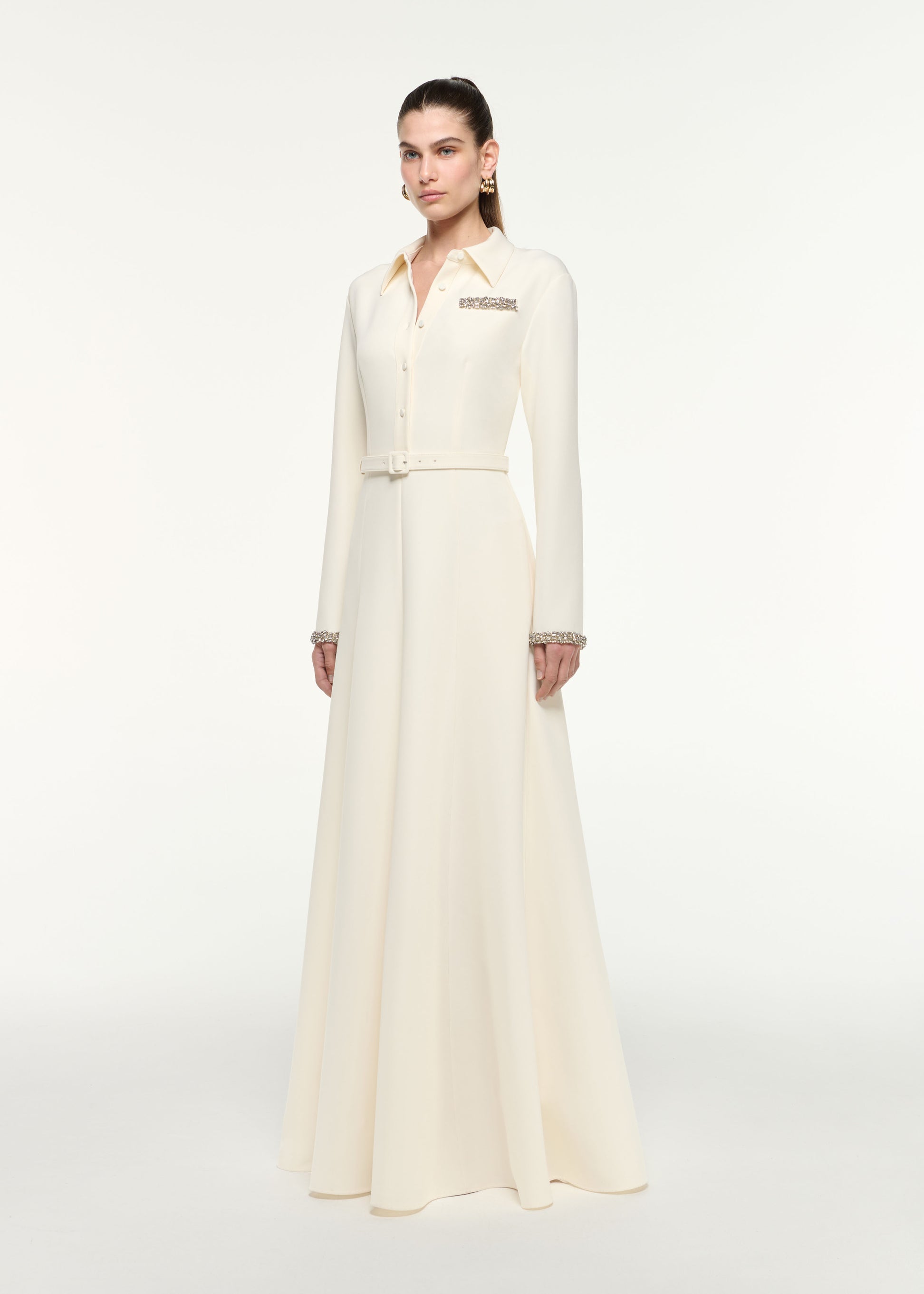 Side view of a model wearing the Shirt Dress in Cream