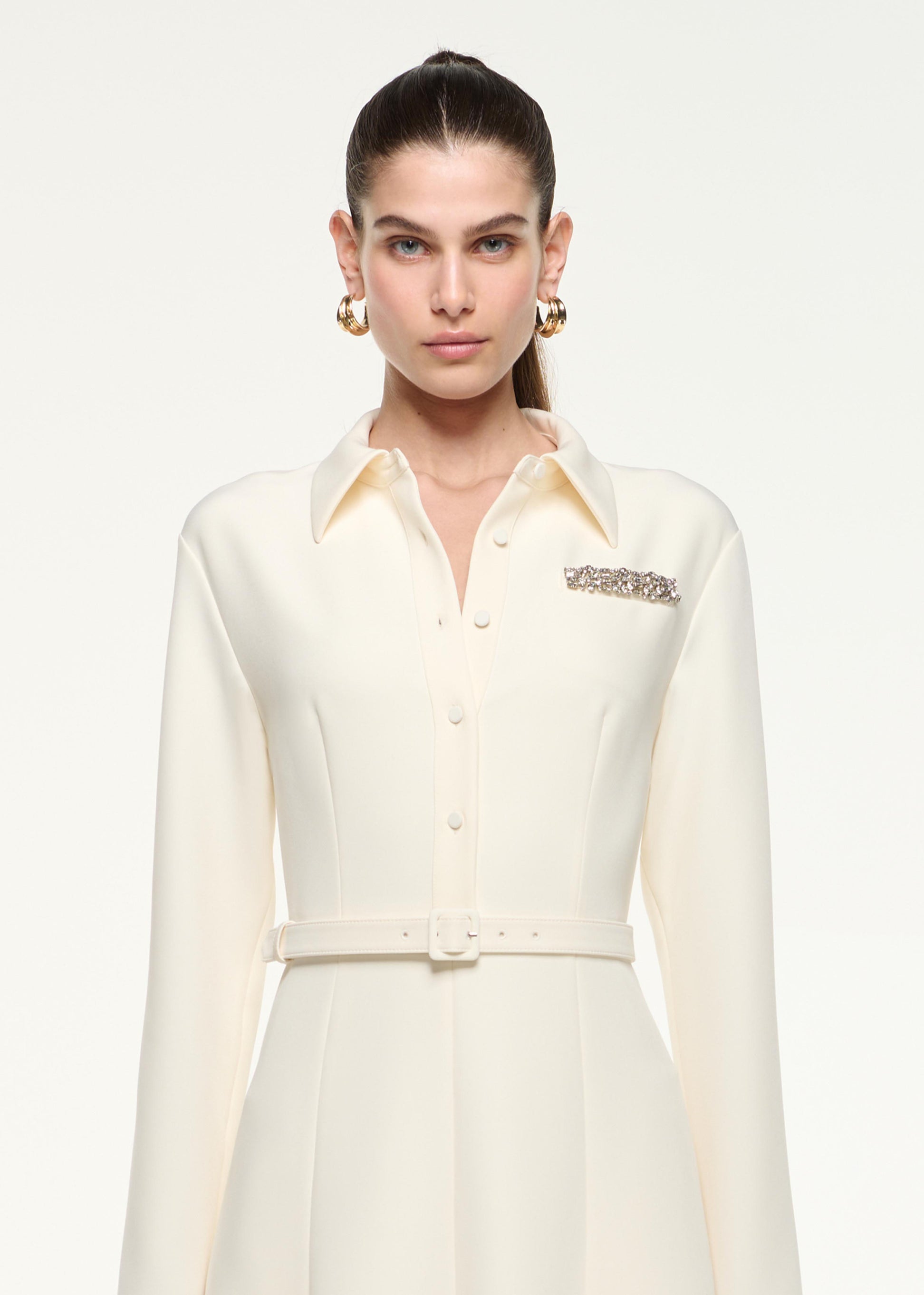 Close up of a model wearing the Shirt Dress in Cream