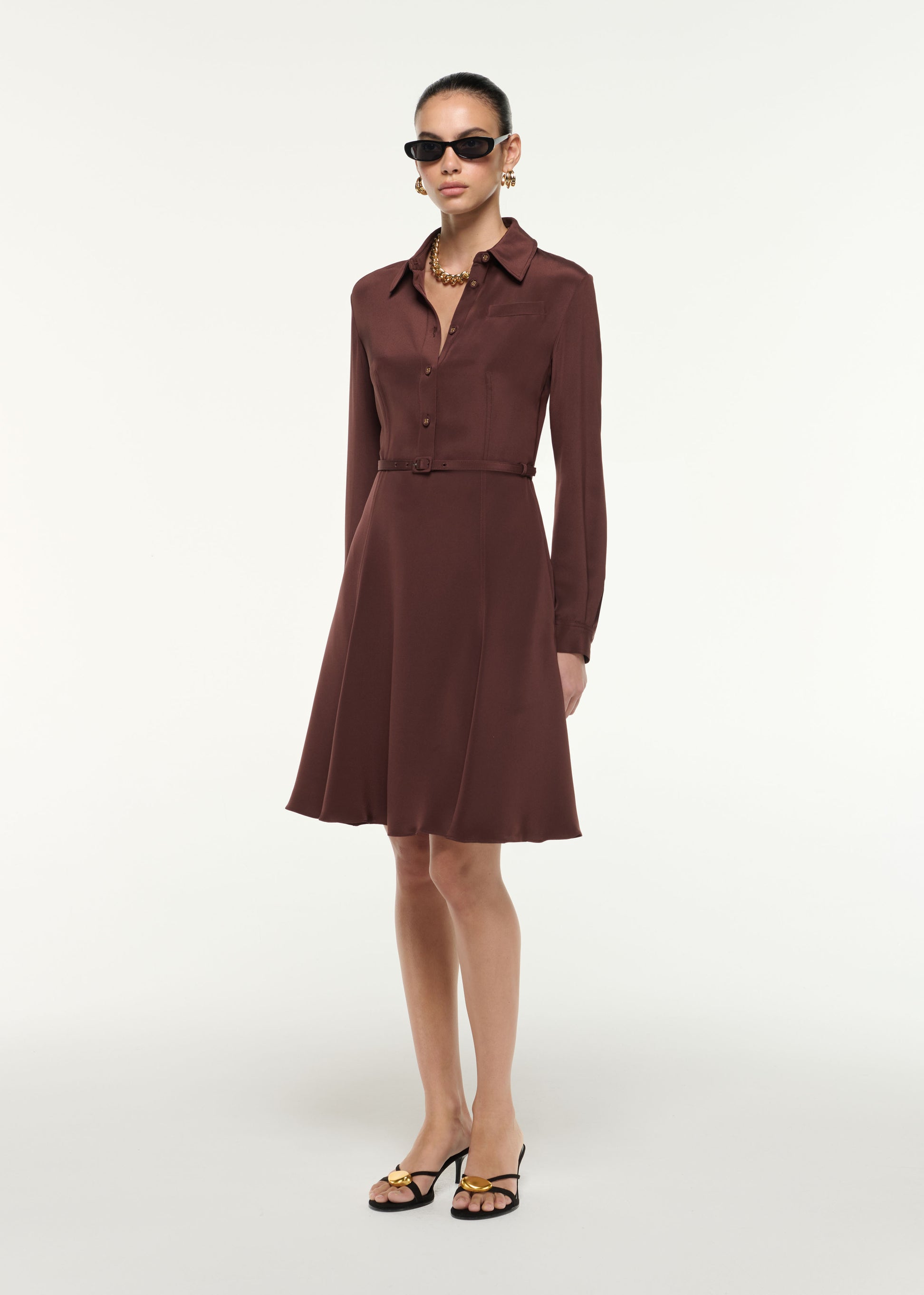 Side view of a model wearing the Silk Midi Shirt Dress in Brown