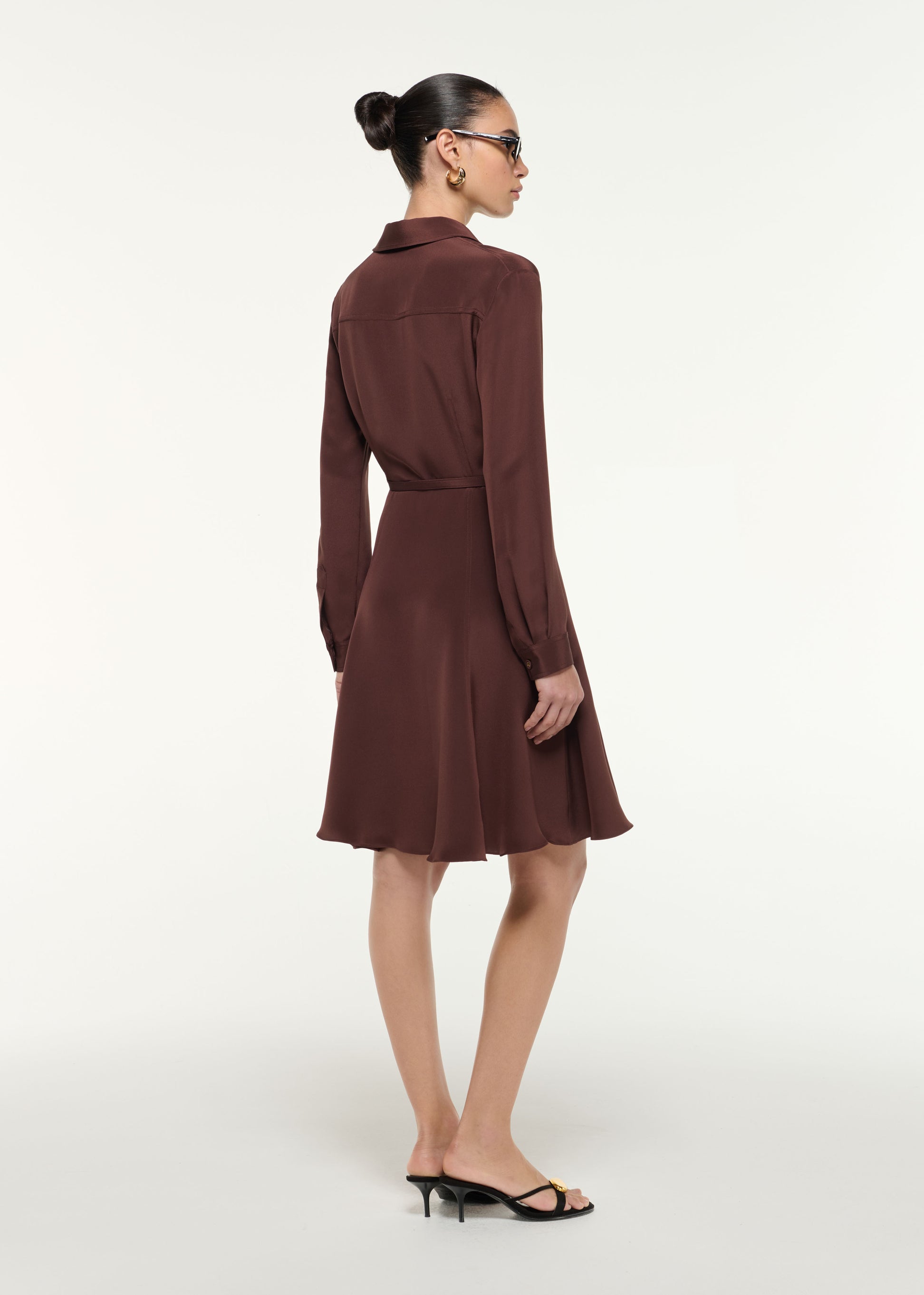 Back view of a model wearing the Silk Midi Shirt Dress in Brown