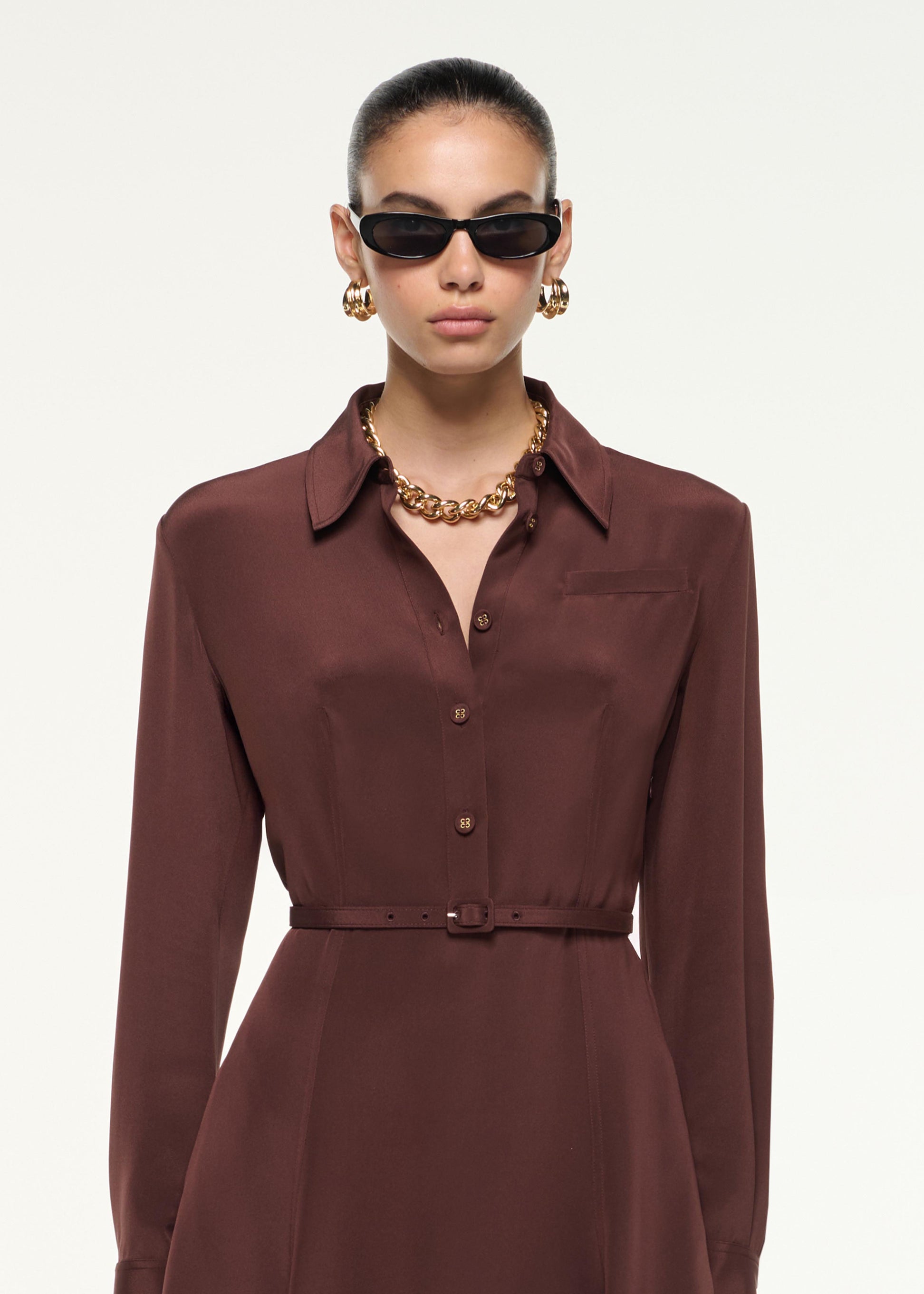 Close up of a model wearing the Silk Midi Shirt Dress in Brown
