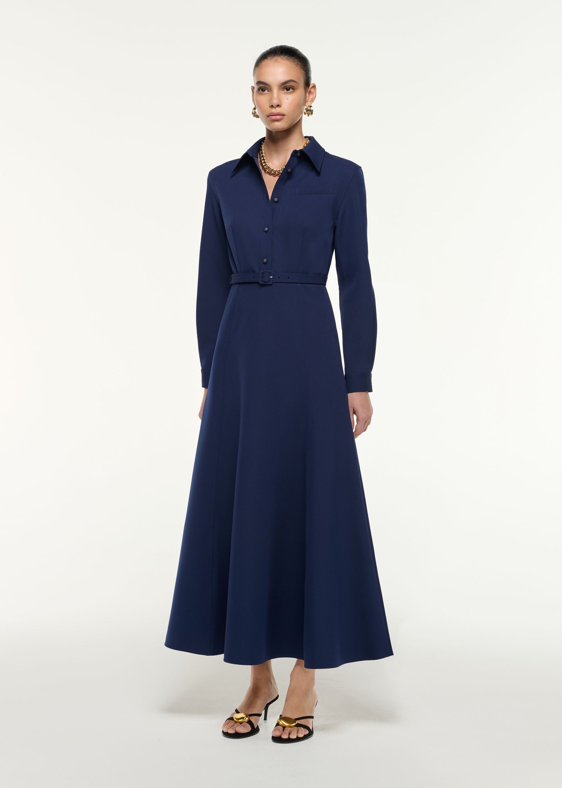 Side view of a model wearing the Maxi Shirt Dress in Navy