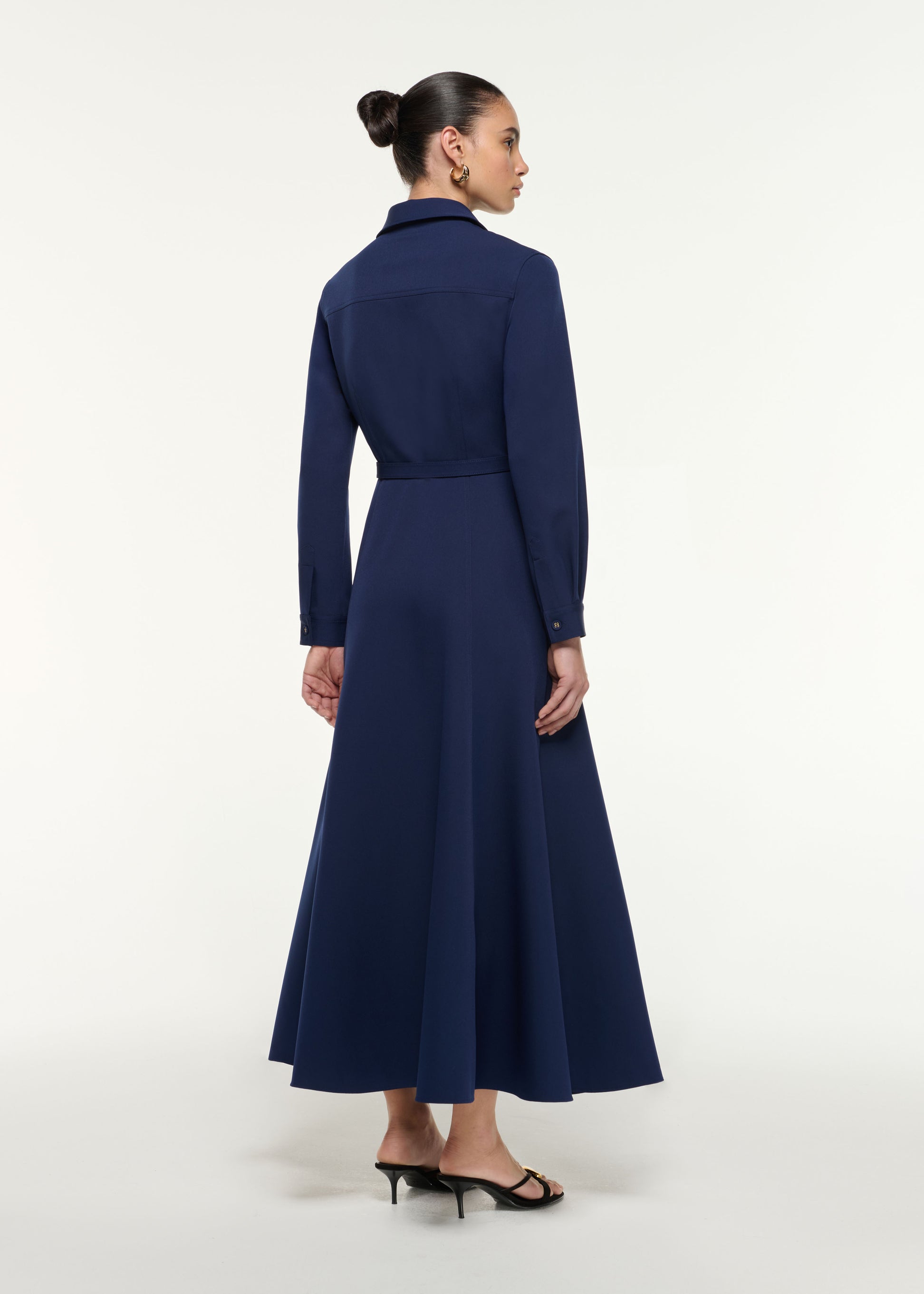 Back view of a model wearing the Maxi Shirt Dress in Navy