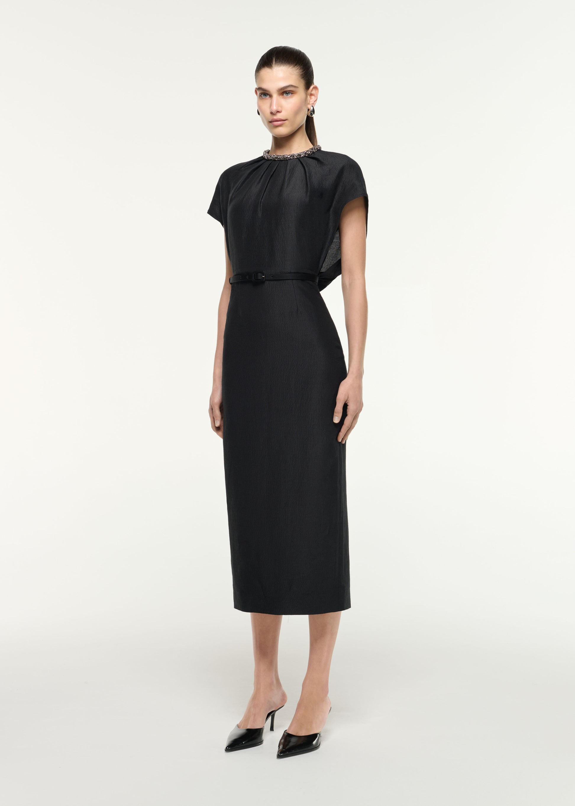 Side view of a model wearing the Silk Jacquard Midi Dress in Black