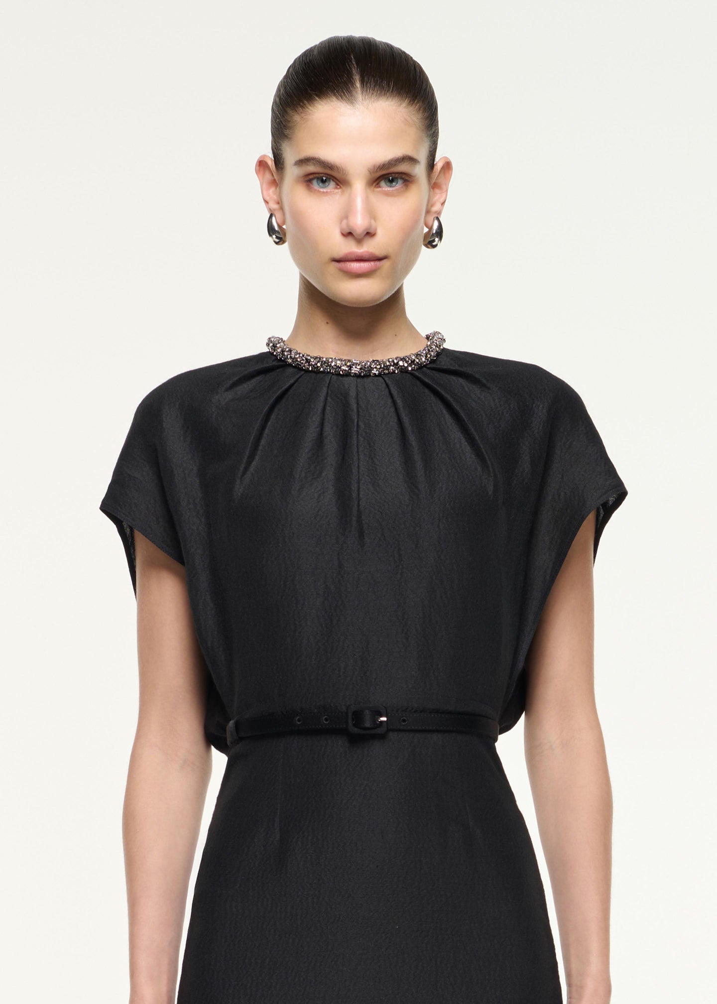 Close up of a model wearing the Silk Jacquard Midi Dress in Black