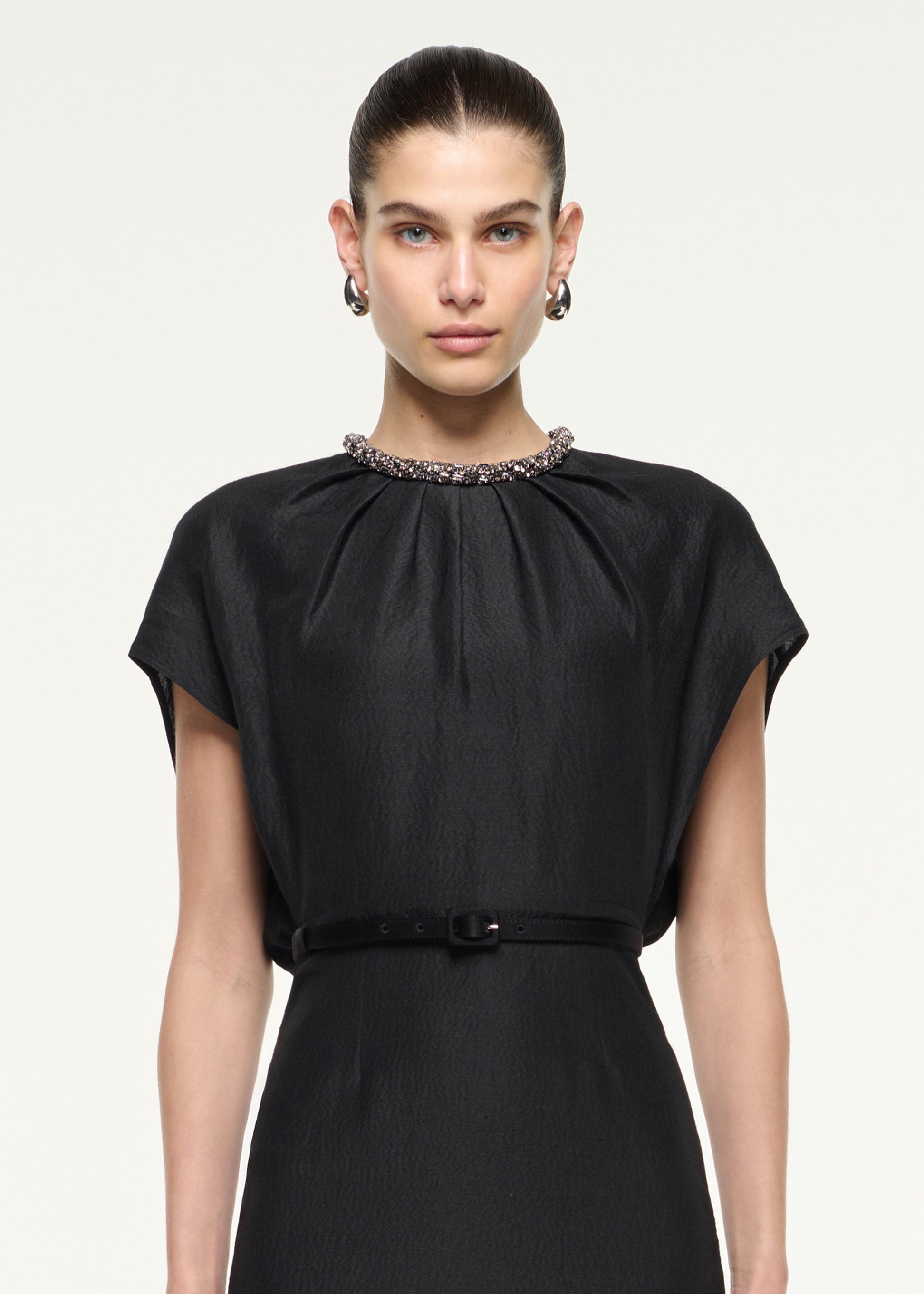 Close up of a model wearing the Silk Jacquard Midi Dress in Black