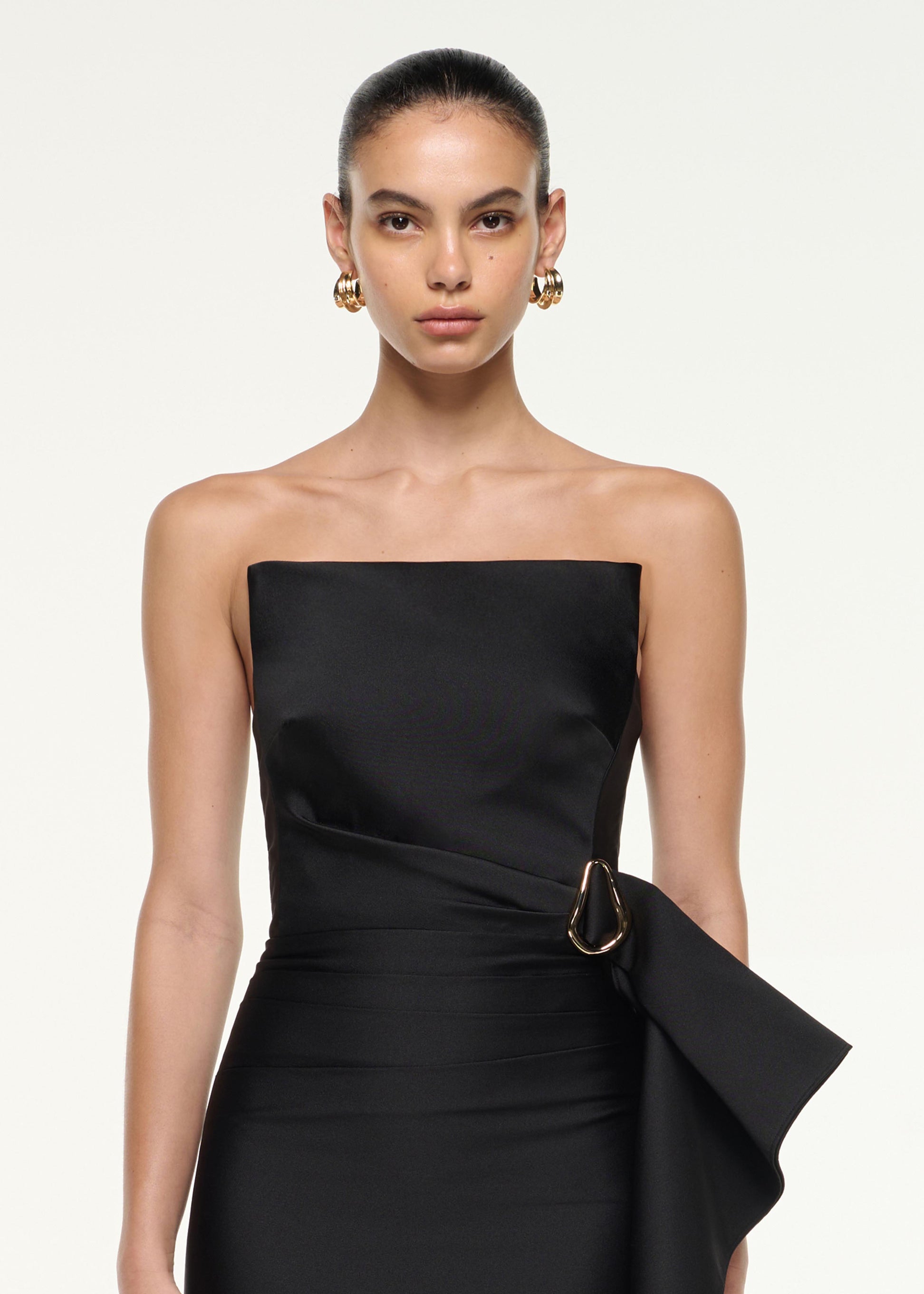 Close up of a model wearing the Draped Taffeta Mini Dress in Black