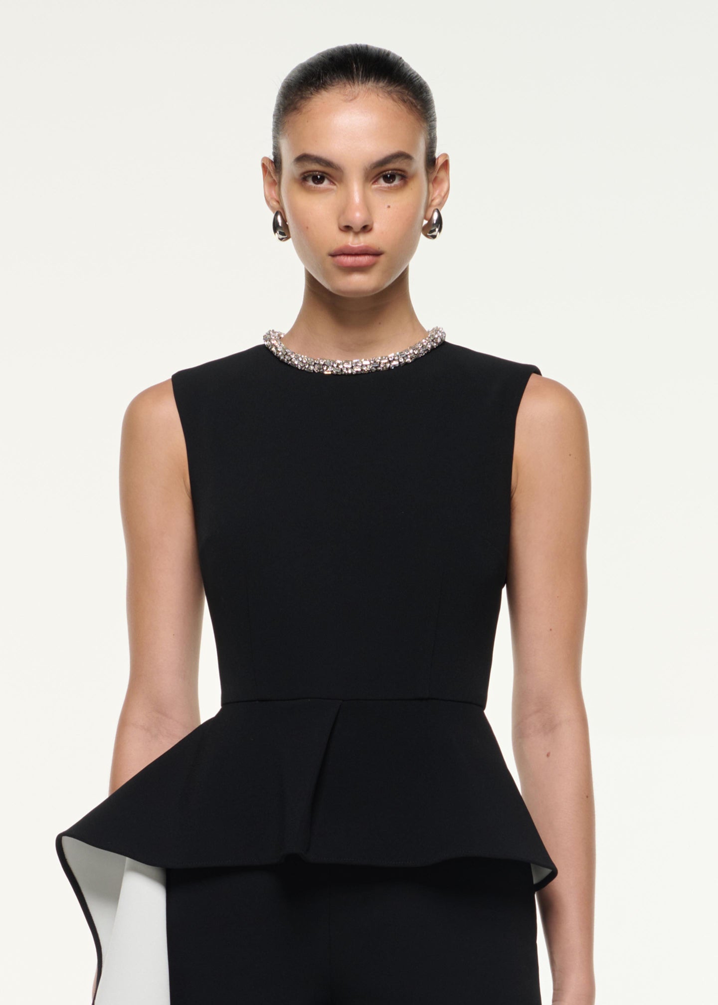 Close up of a model wearing the Waist Drape Jumpsuit in Monochrome