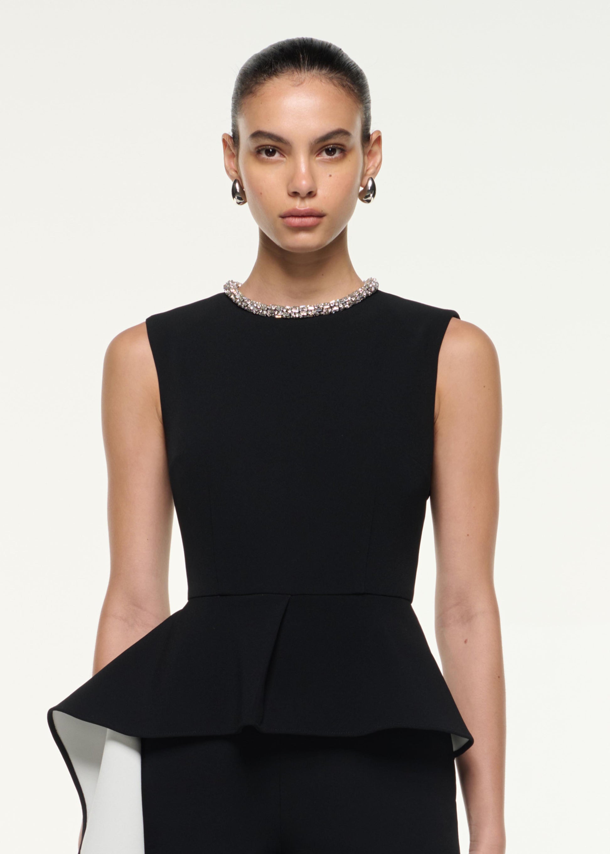 Close up of a model wearing the Waist Drape Jumpsuit in Monochrome