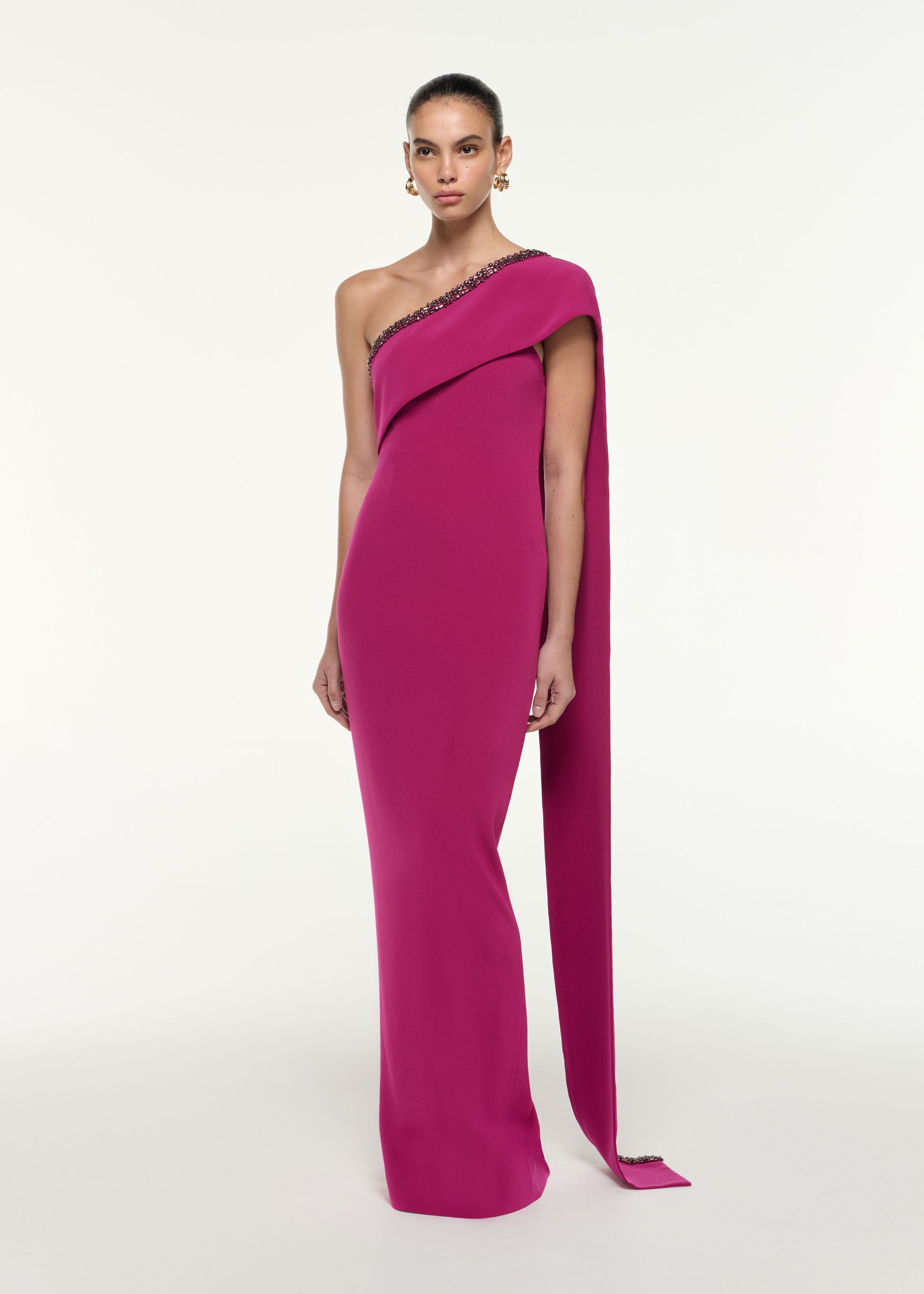 Side view of a model wearing the Sash Satin Crepe Gown in Dark Pink