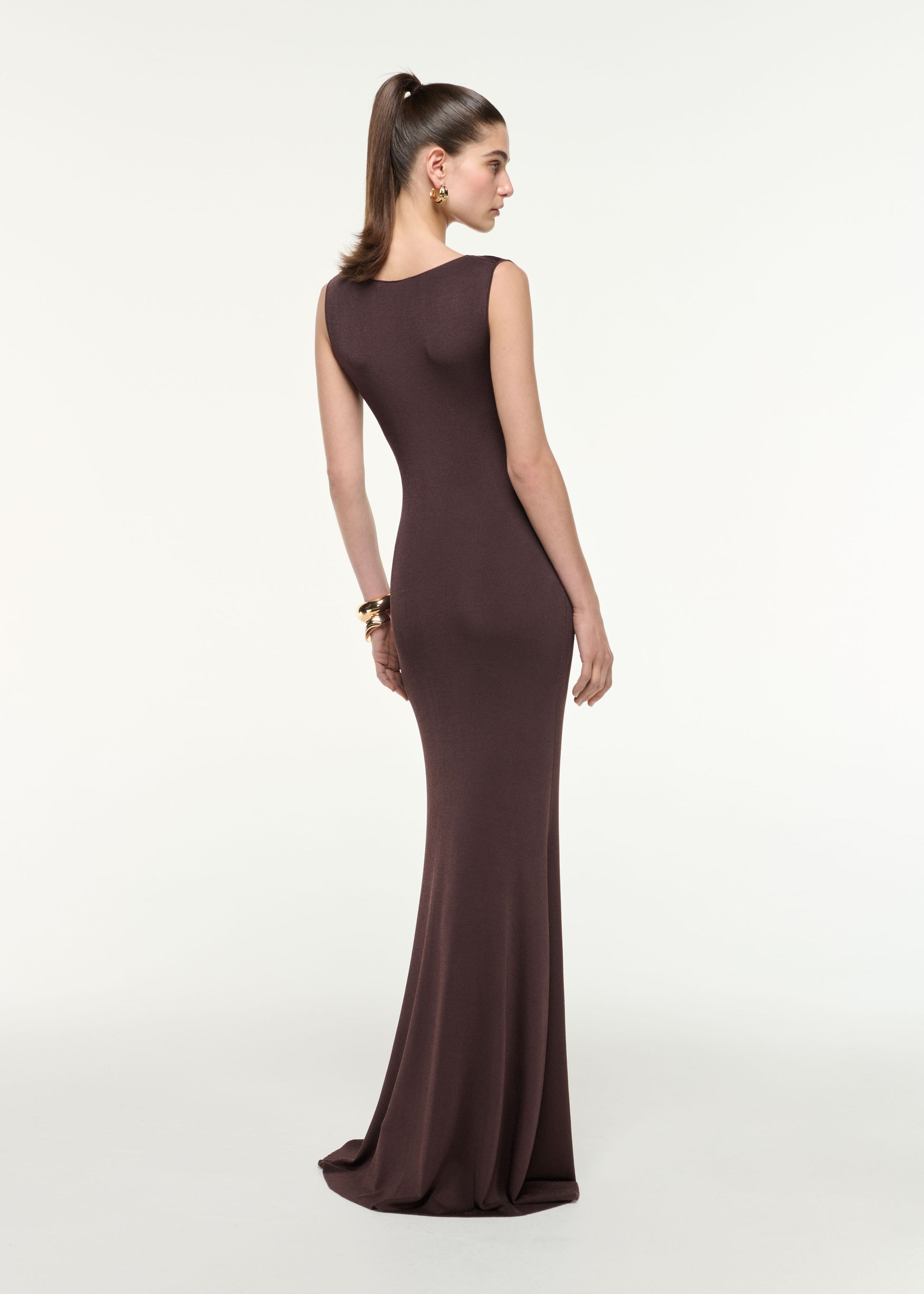 Back view of a model wearing the Cowl Neck Knit Maxi Dress in Brown