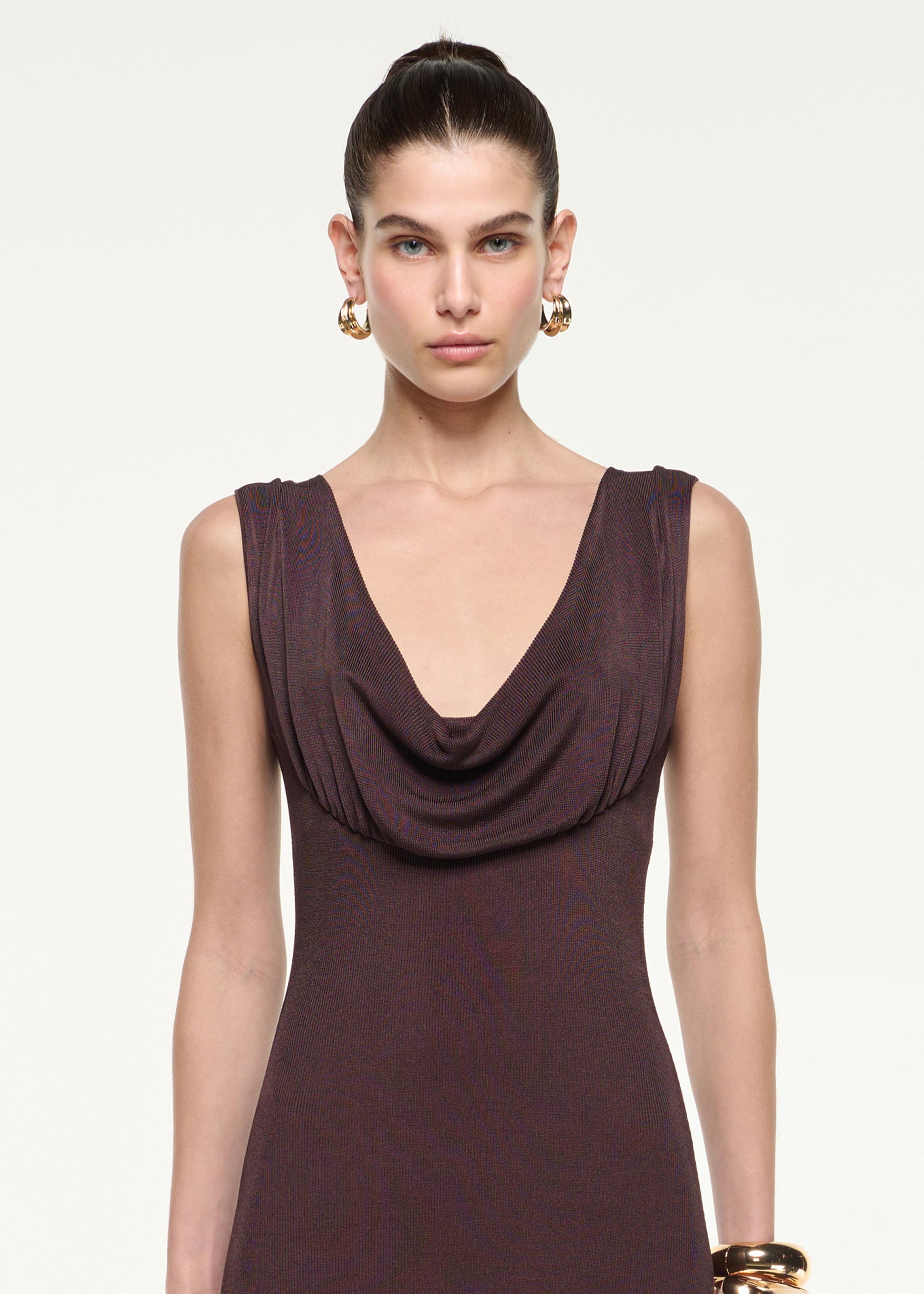 Close up of a model wearing the Cowl Neck Knit Maxi Dress in Brown