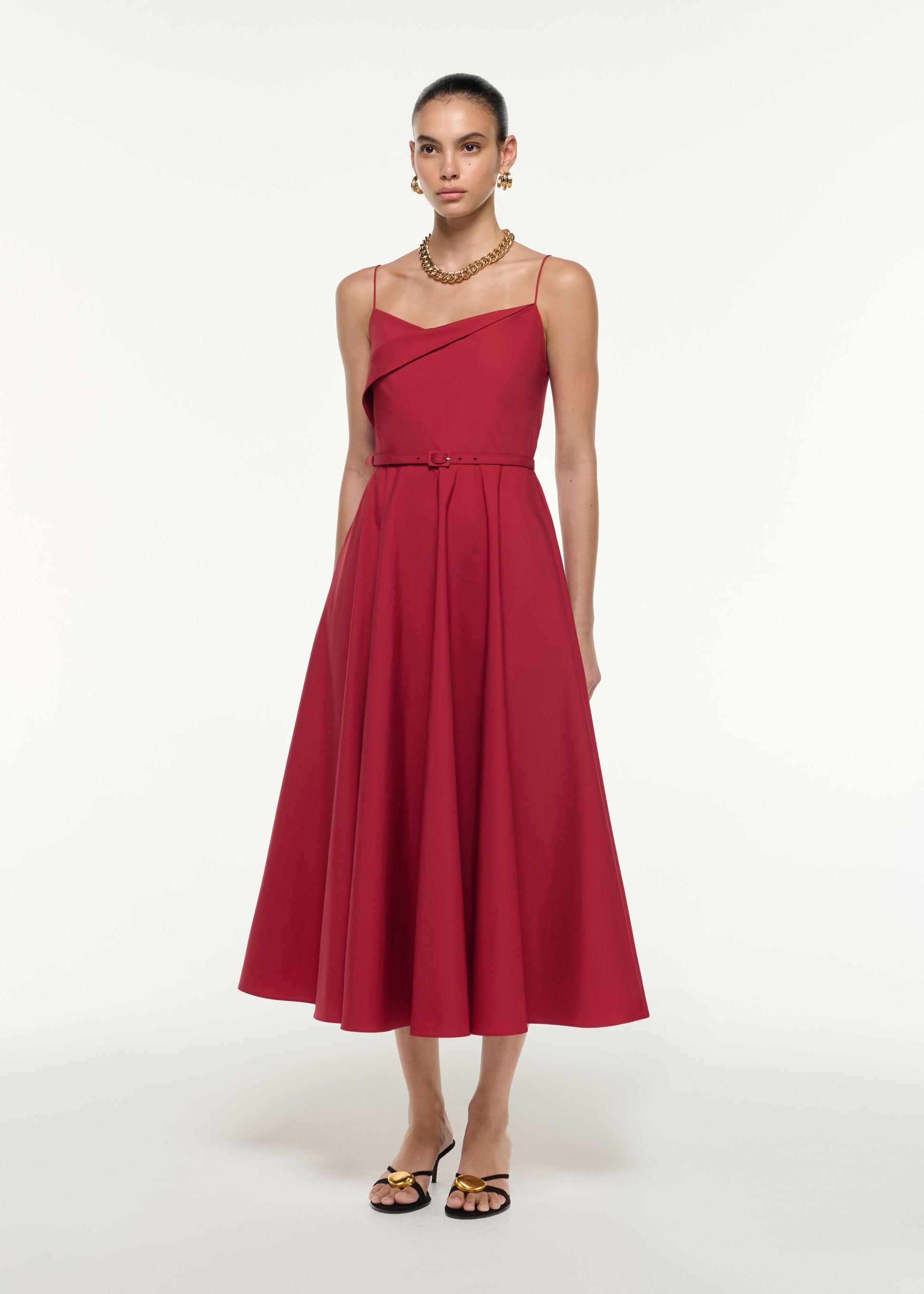 Side view of a model wearing the Cotton Poplin Strap Midi Dress in Dark Red