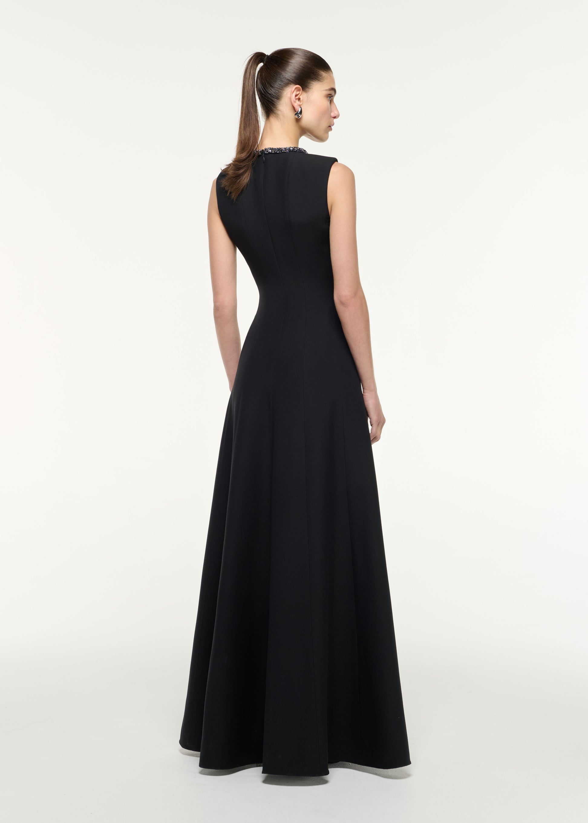 Back view of a model wearing the Diamante Trim Wool Silk Gown in Black