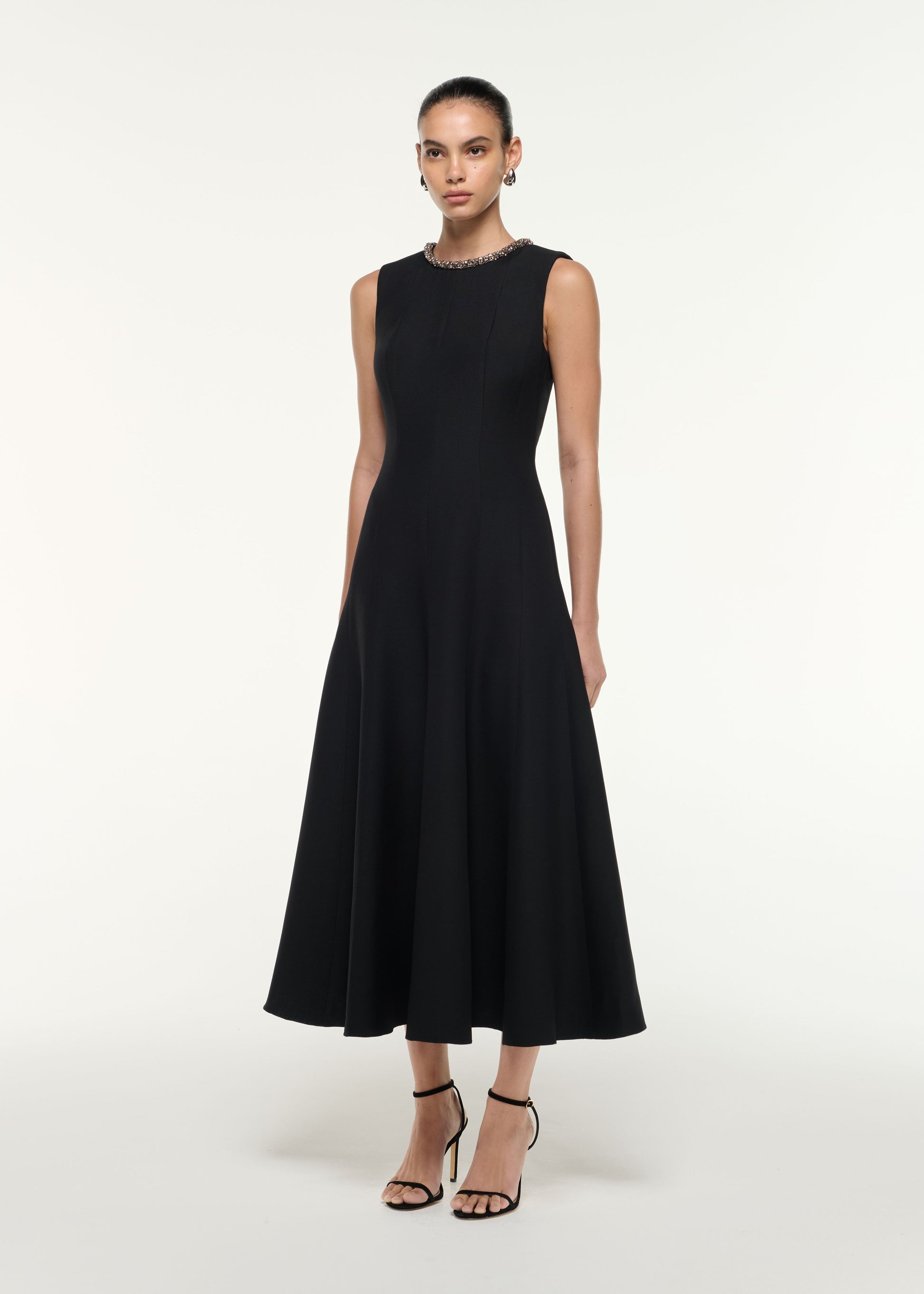 Side view of a model wearing the Diamante Trim Wool Silk Midi Dress in Black