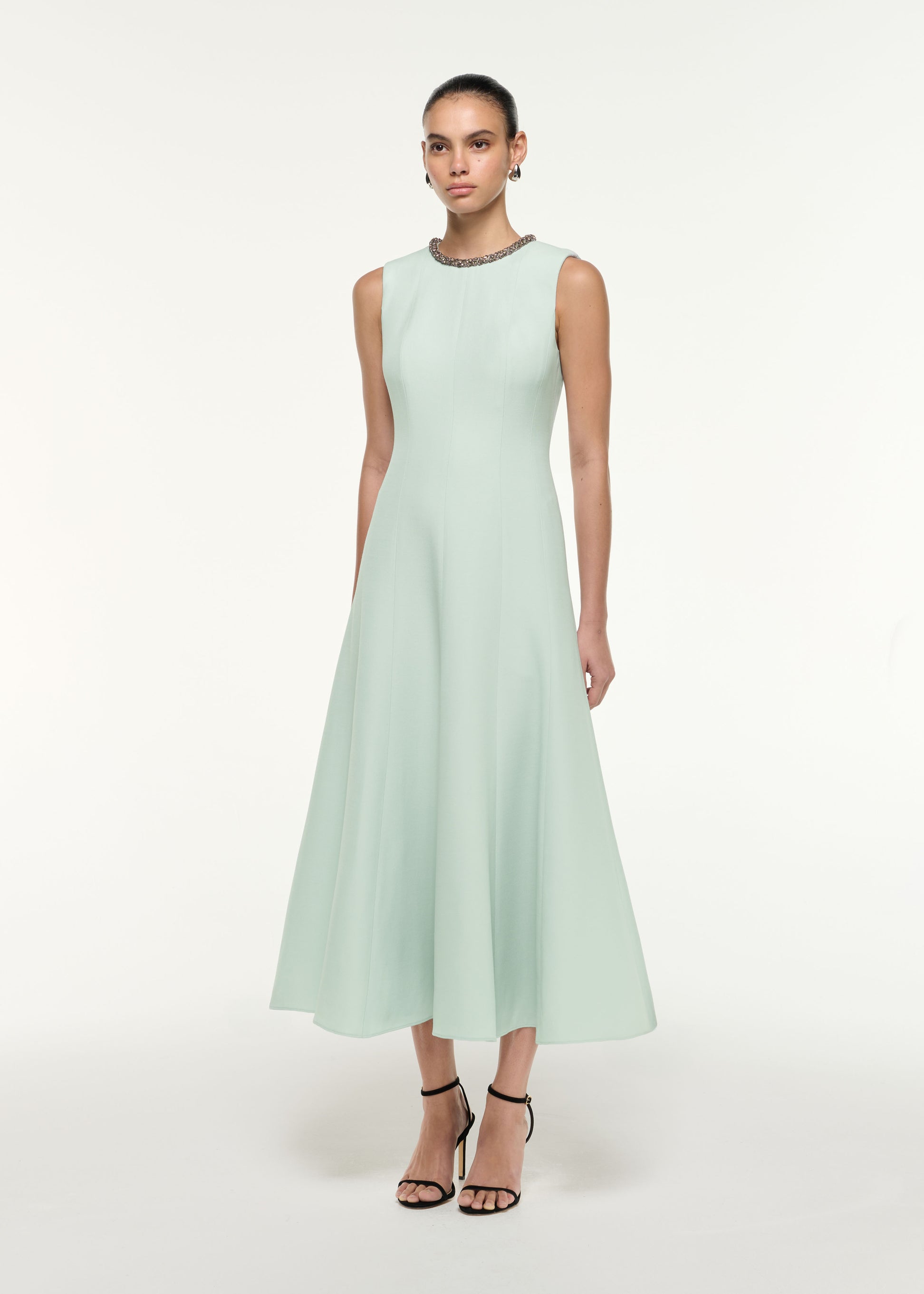 Side view of a model wearing the Diamante Trim Wool Silk Midi Dress in Mint