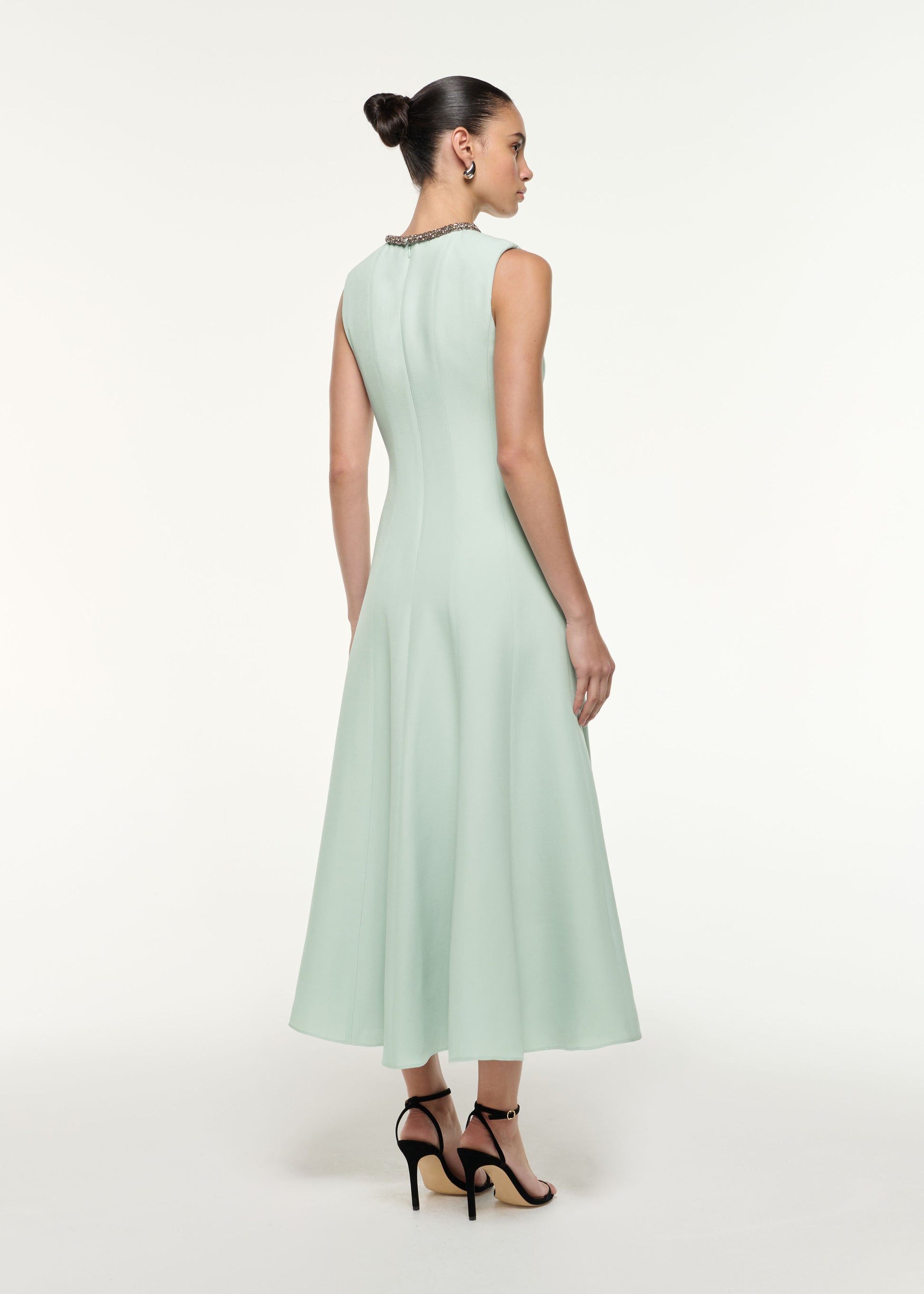 Back view of a model wearing the Diamante Trim Wool Silk Midi Dress in Mint