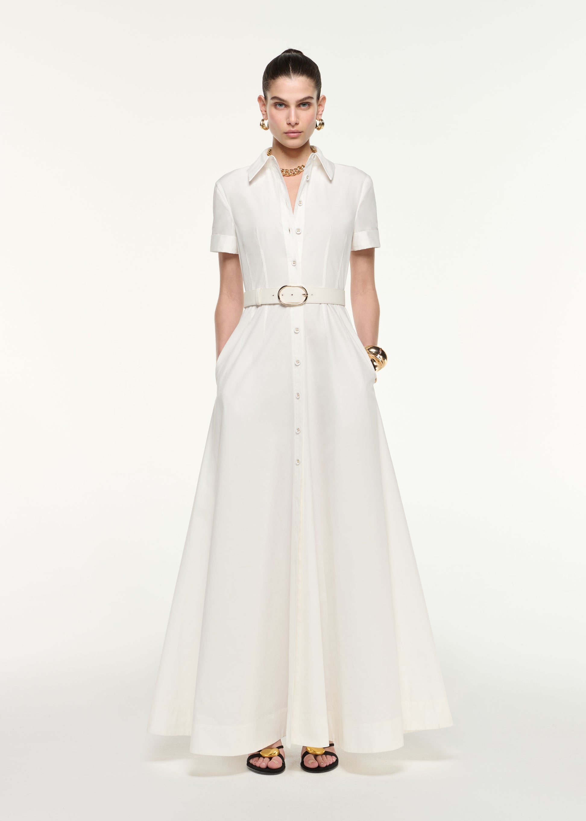 Front view of a model wearing the Shirt Dress Gown in White