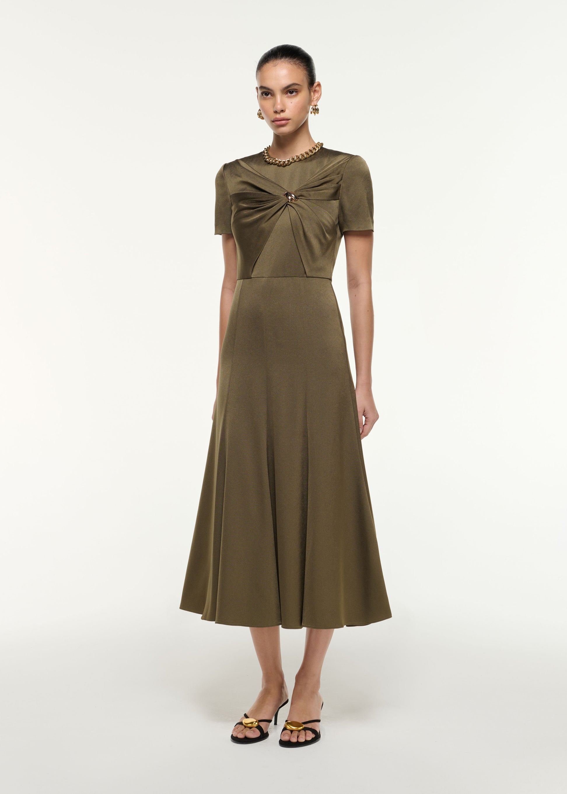 Side view of a model wearing the Satin Crepe Drape Midi Dress in Khaki