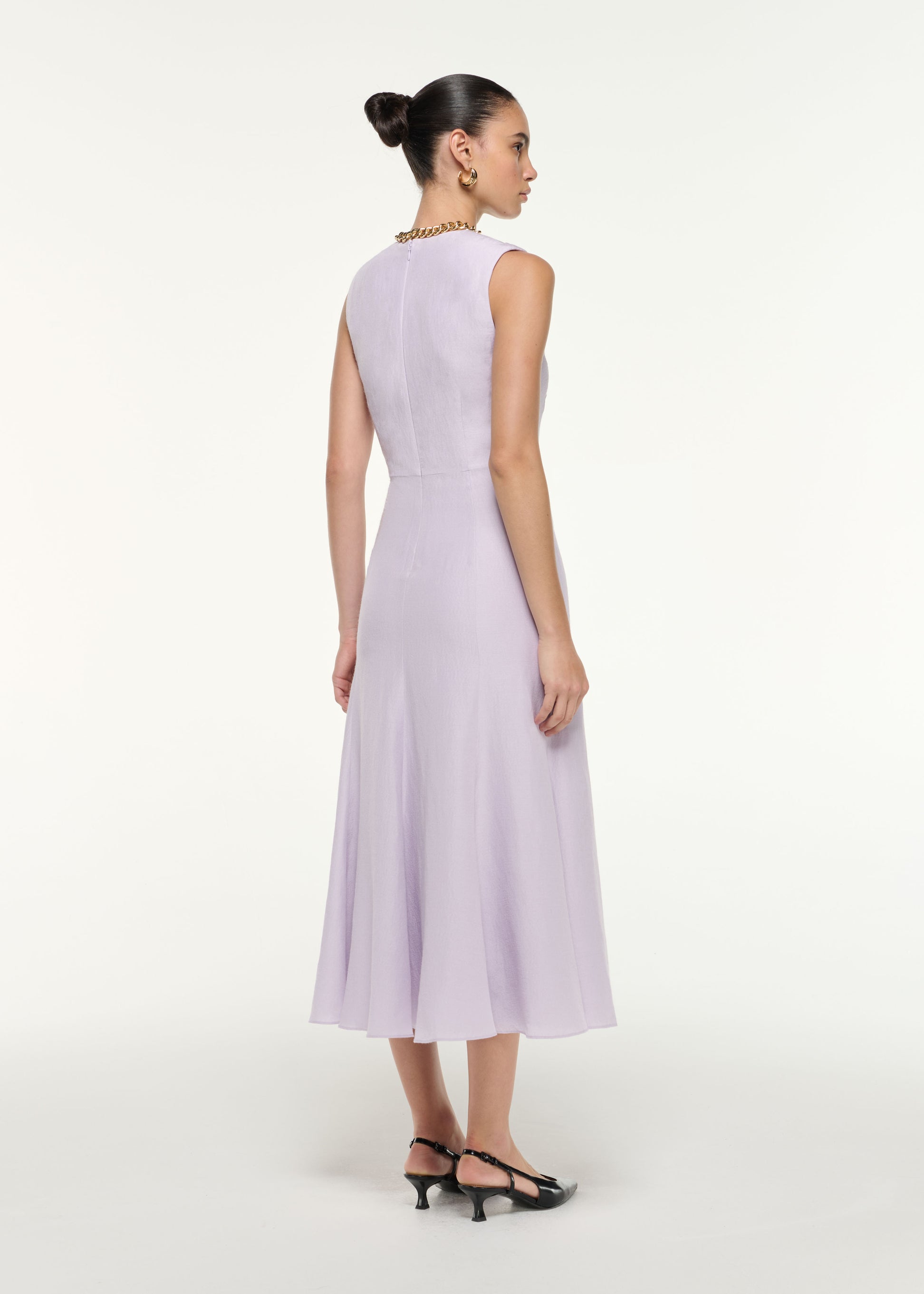 Back view of a model wearing the Silk Jacquard Midi Dress in Lilac