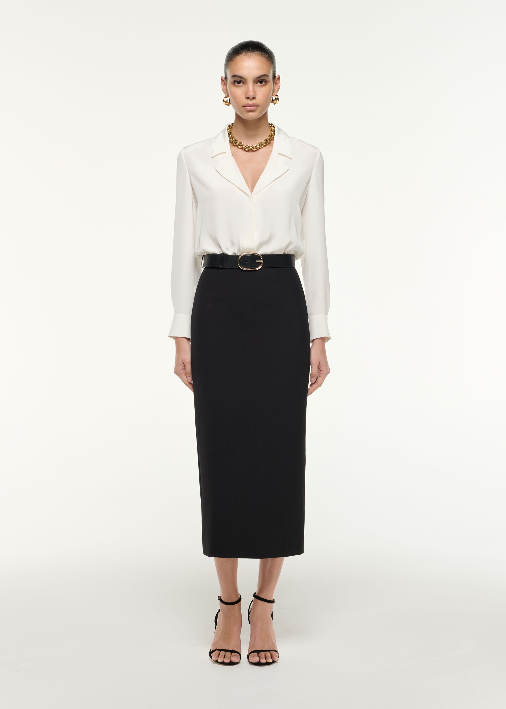 Front view of a model wearing the Silk Bodysuit in White