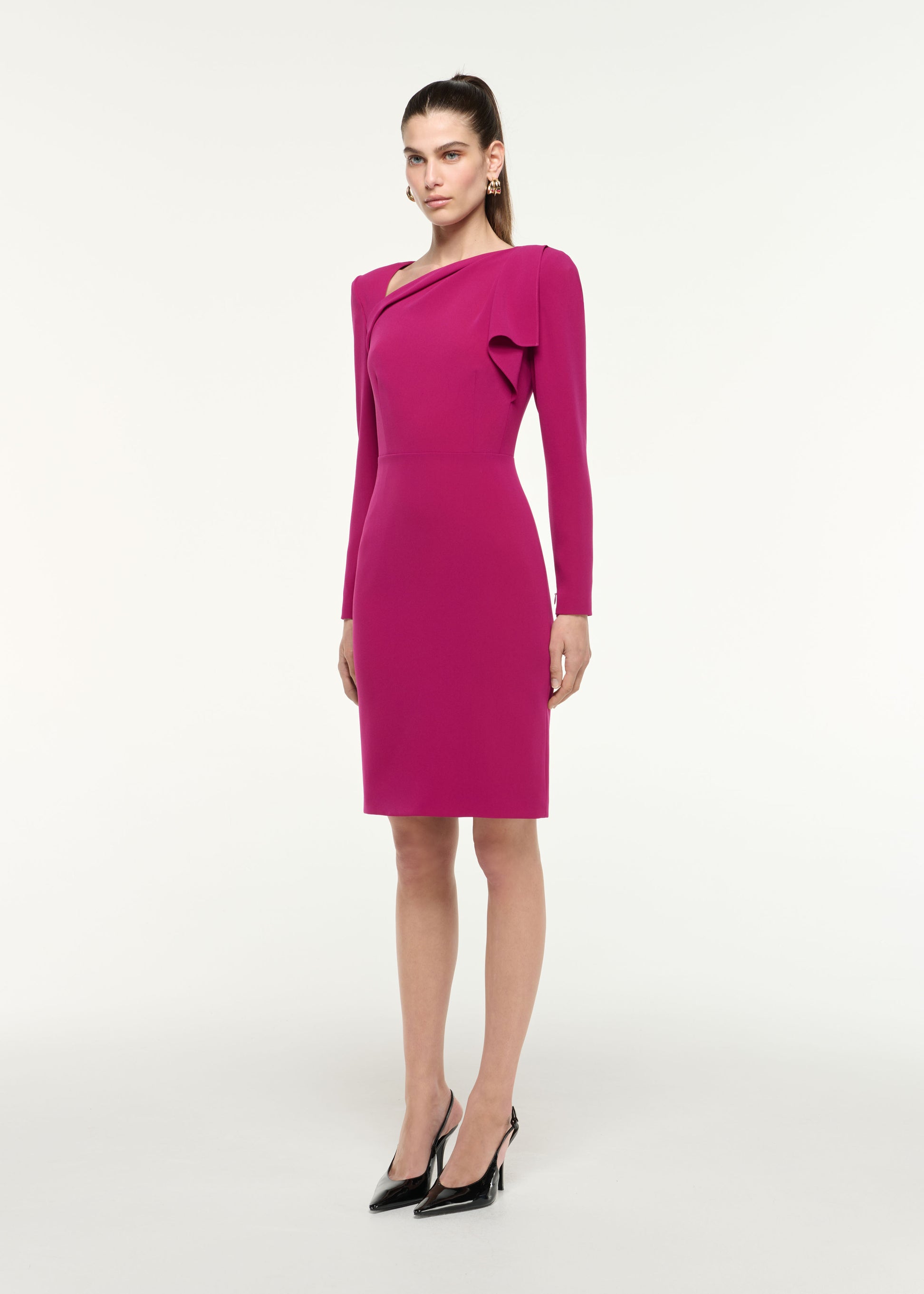 Side view of a model wearing the Shoulder Drape Mini Dress in Dark Pink