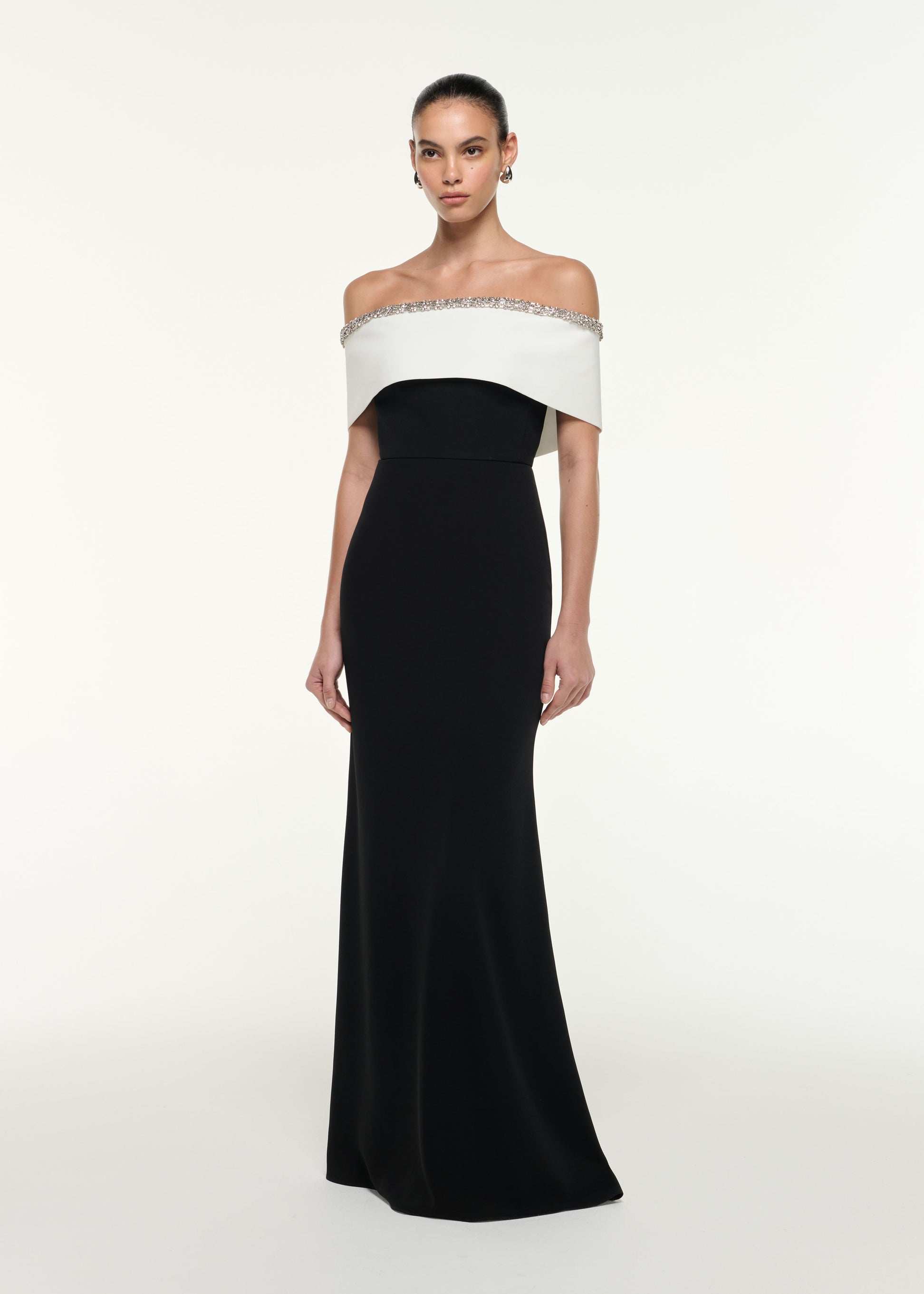 Side view of a model wearing the Off Shoulder Gown in Monochrome