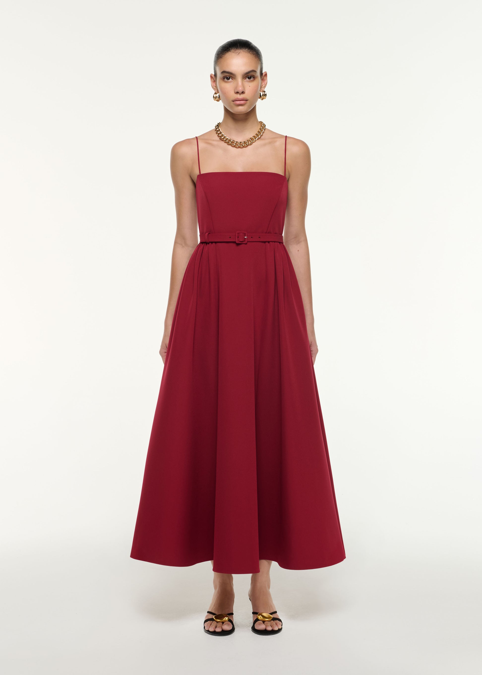 Front view of a model wearing the Belted Maxi Dress in Dark Red