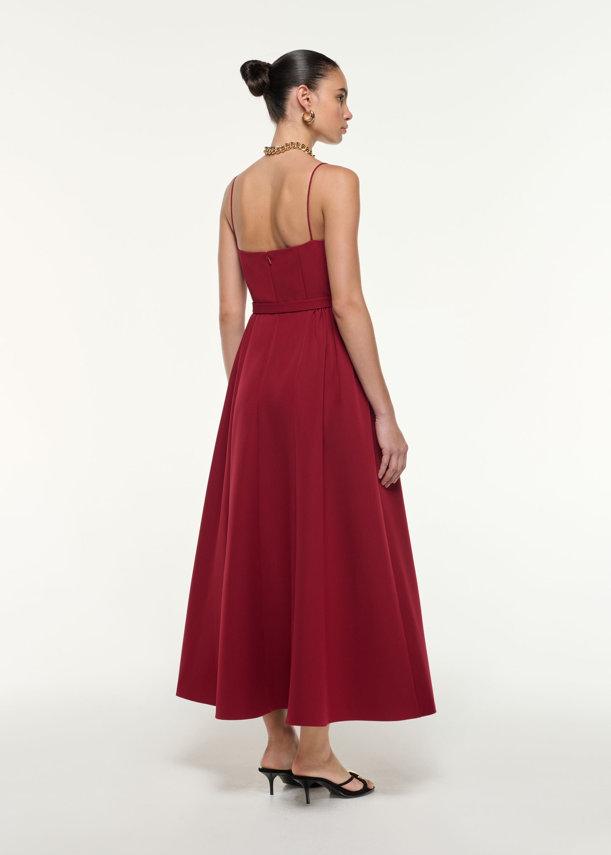 Back view of a model wearing the Belted Maxi Dress in Dark Red