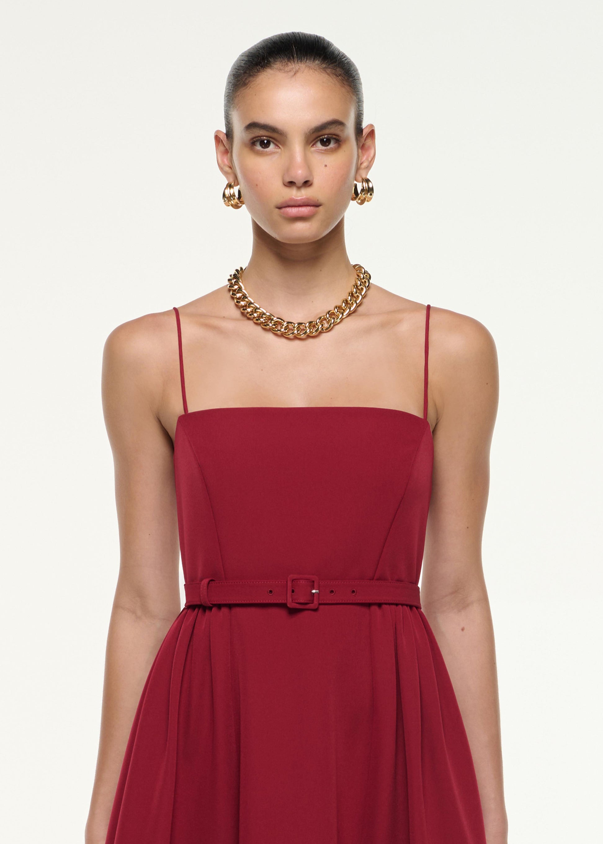 Close up of a model wearing the Belted Maxi Dress in Dark Red