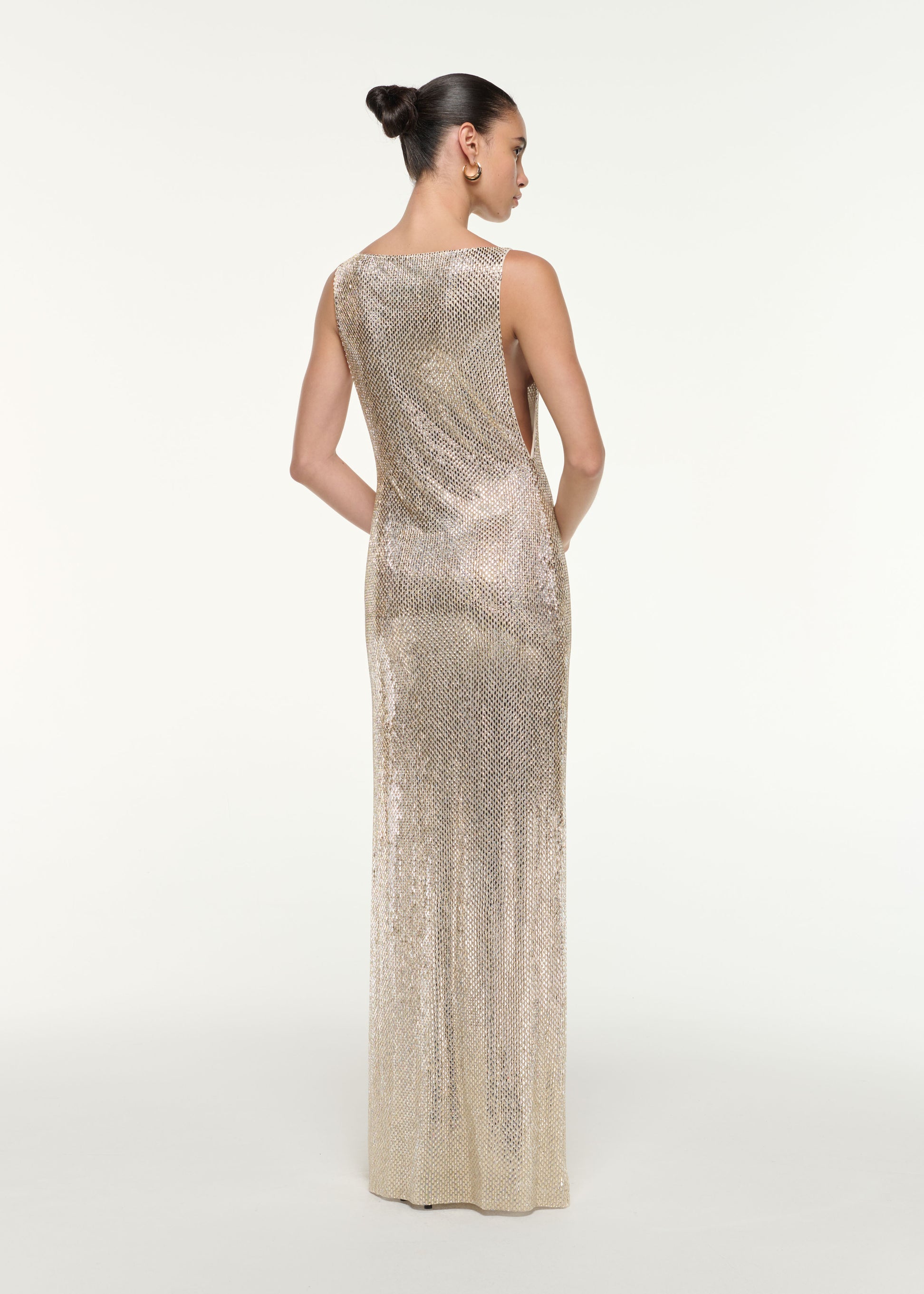 Back view of a model wearing the Mesh Diamante Gown in Champagne