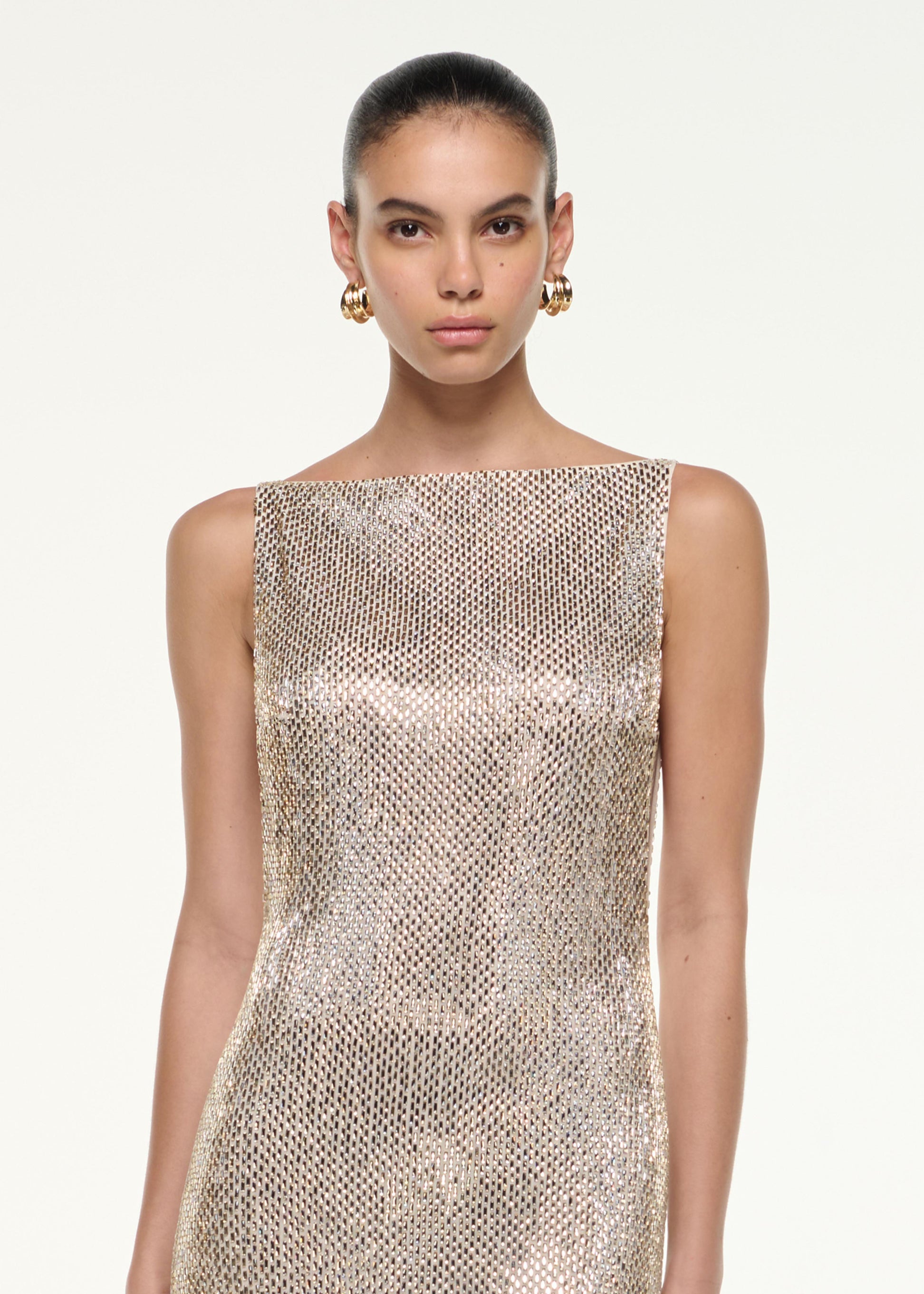 Close up of a model wearing the Mesh Diamante Gown in Champagne