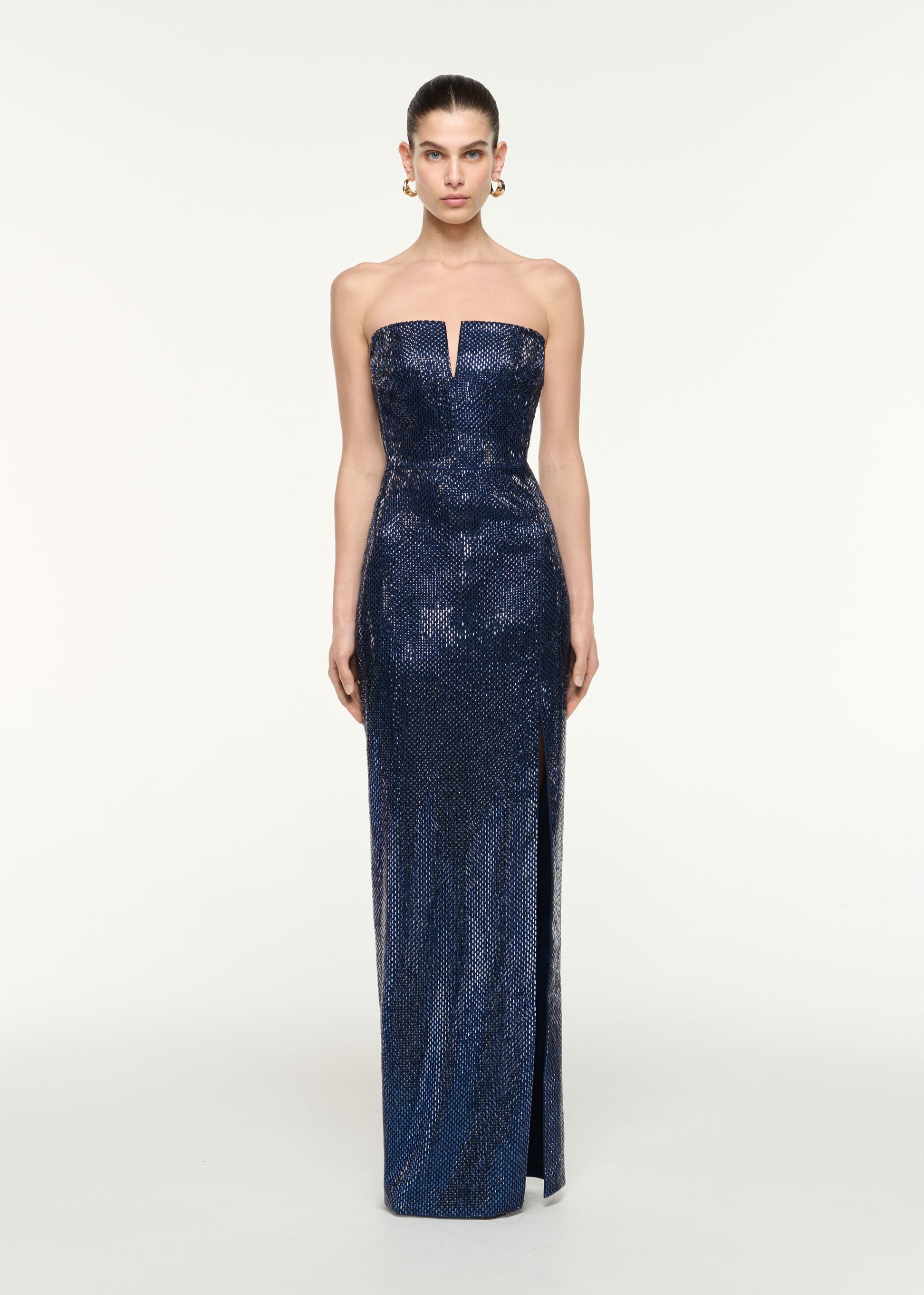 Front view of a model wearing the Strapless All Over Diamante Gown in Navy