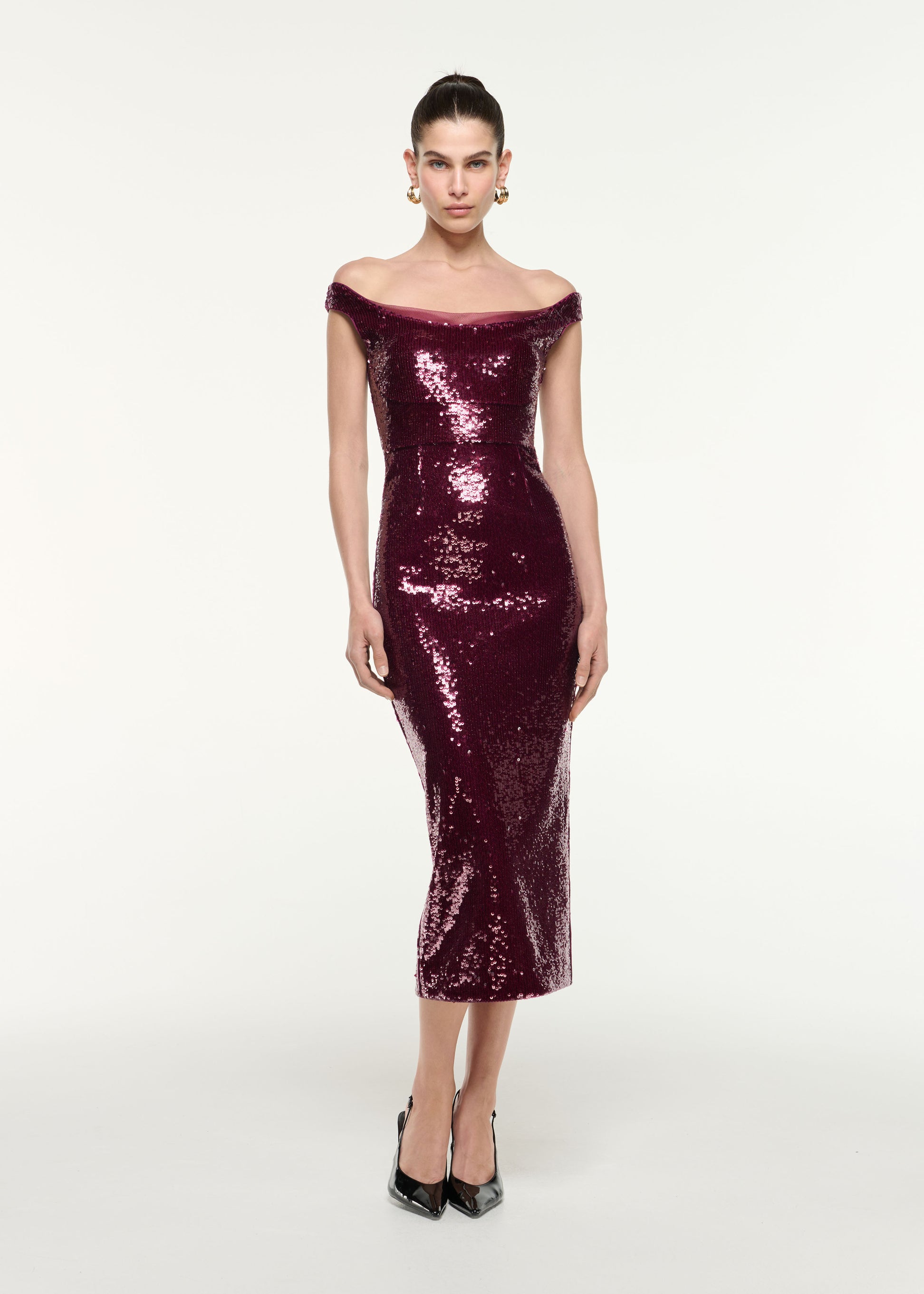 Front view of a model wearing the Off Shoulder Sequin Midi Dress in Dark Pink