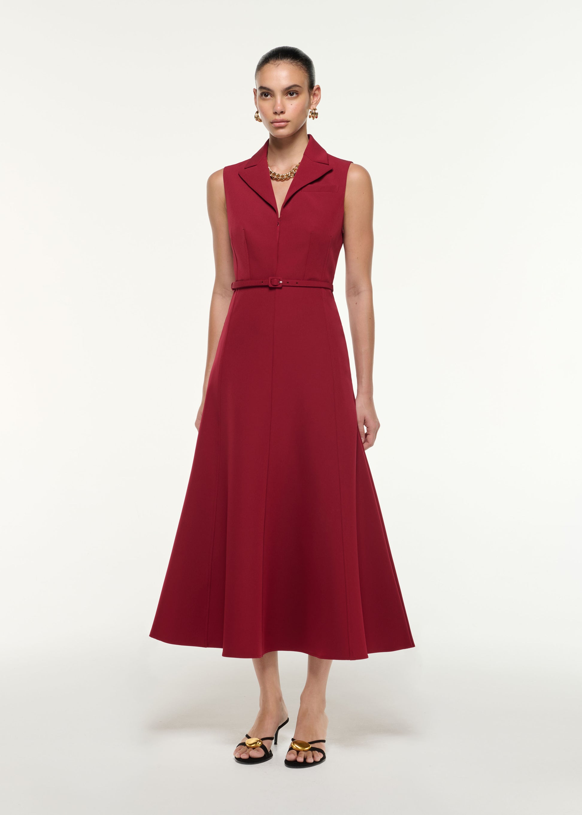 Side view of a model wearing the Belted Collar Midi Dress in Dark Red