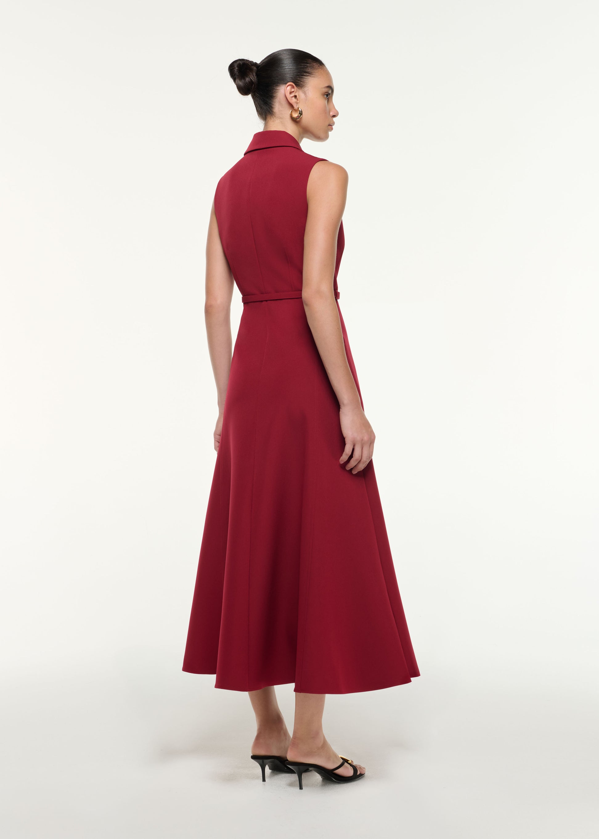 Back view of a model wearing the Belted Collar Midi Dress in Dark Red