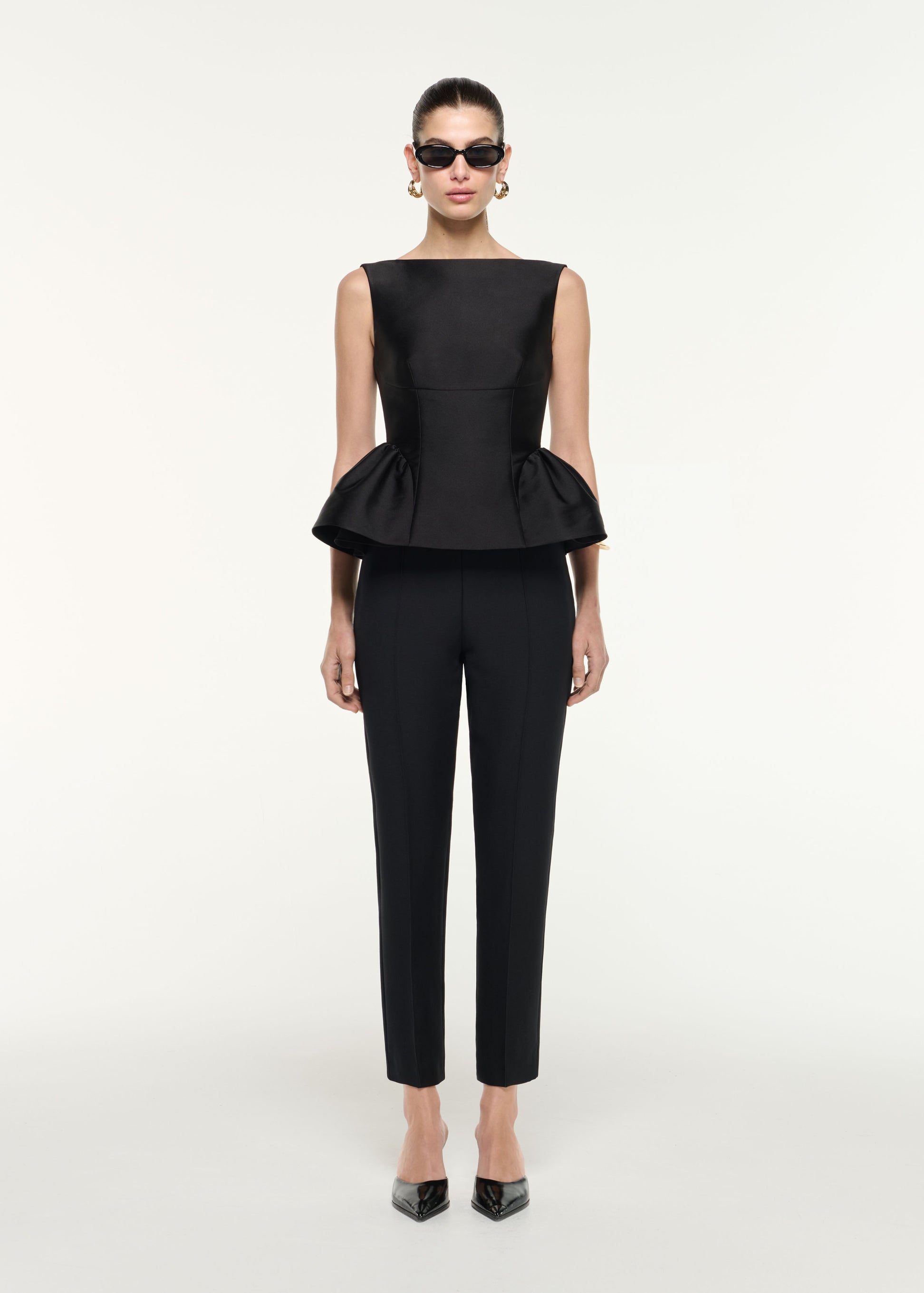 Front view of a model wearing the Wool Silk Cropped Trouser in Black