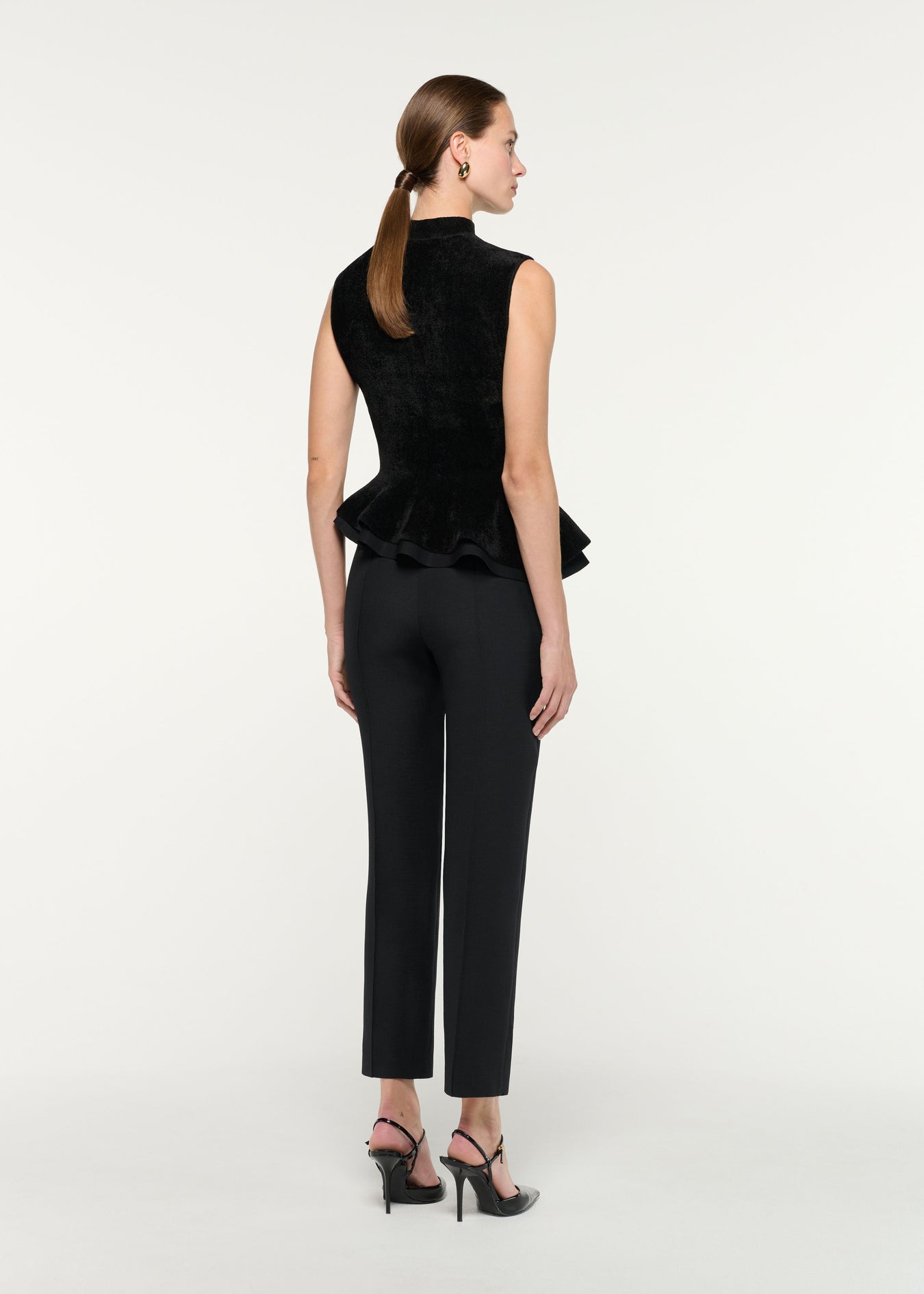 Back view of a model wearing the Wool Silk Cropped Trouser