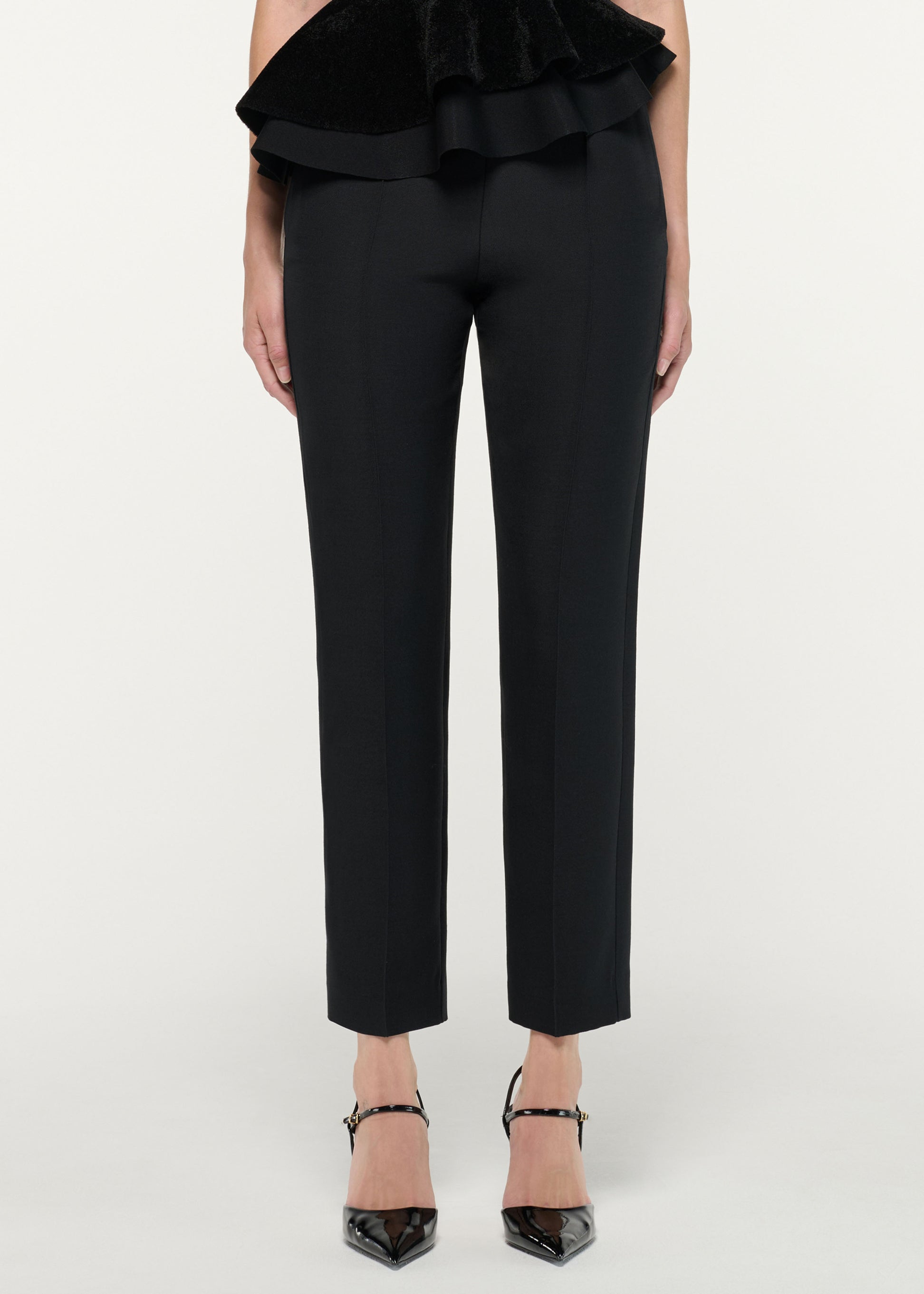 Close up of a model wearing the Wool Silk Cropped Trouser