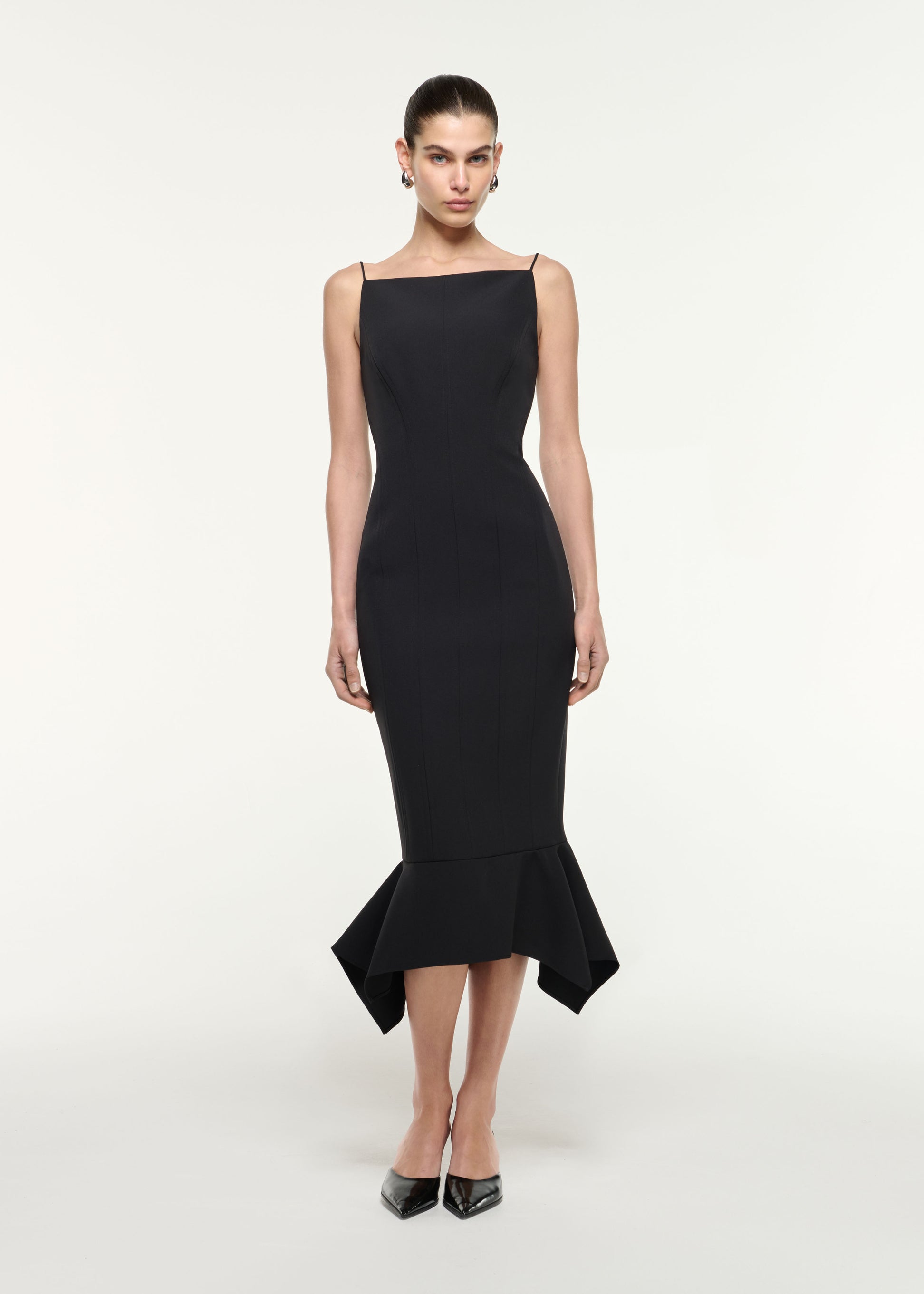Front view of a model wearing the Fishtail Hem Midi Dress in Black