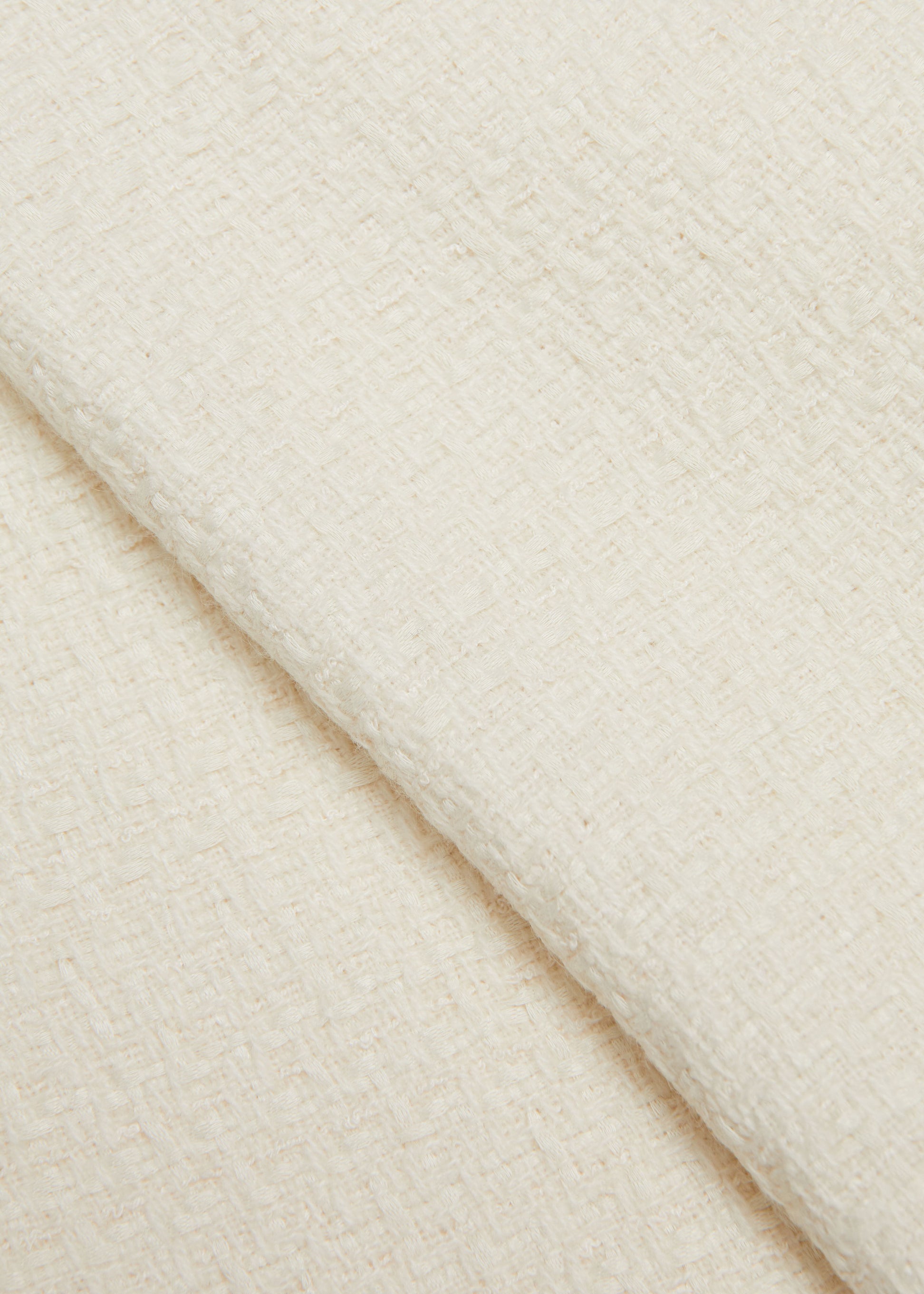 Close up of a model wearing the Boucle Midi Skirt in Cream