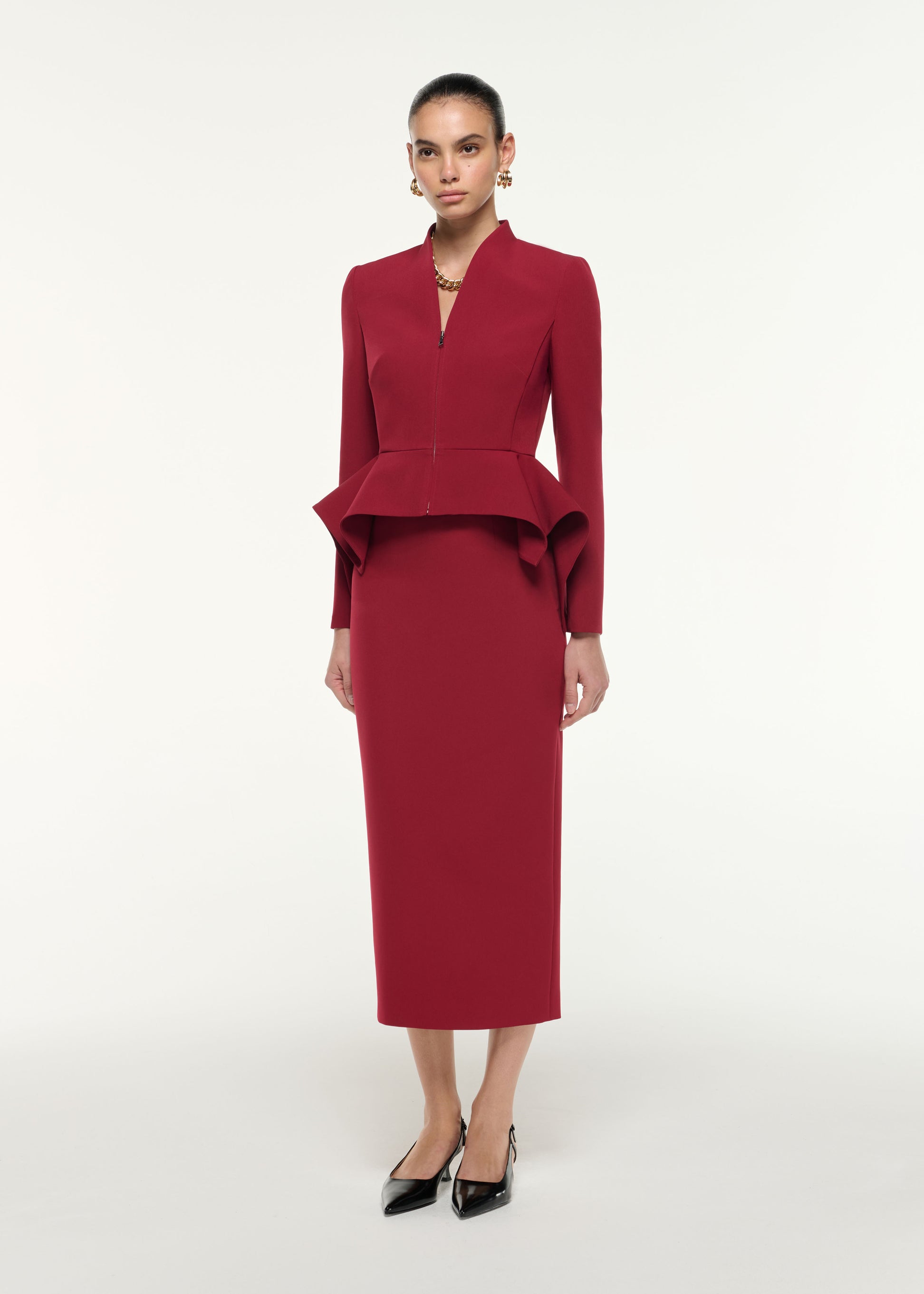 Side view of a model wearing the Light Crepe Midi Skirt in Dark Red