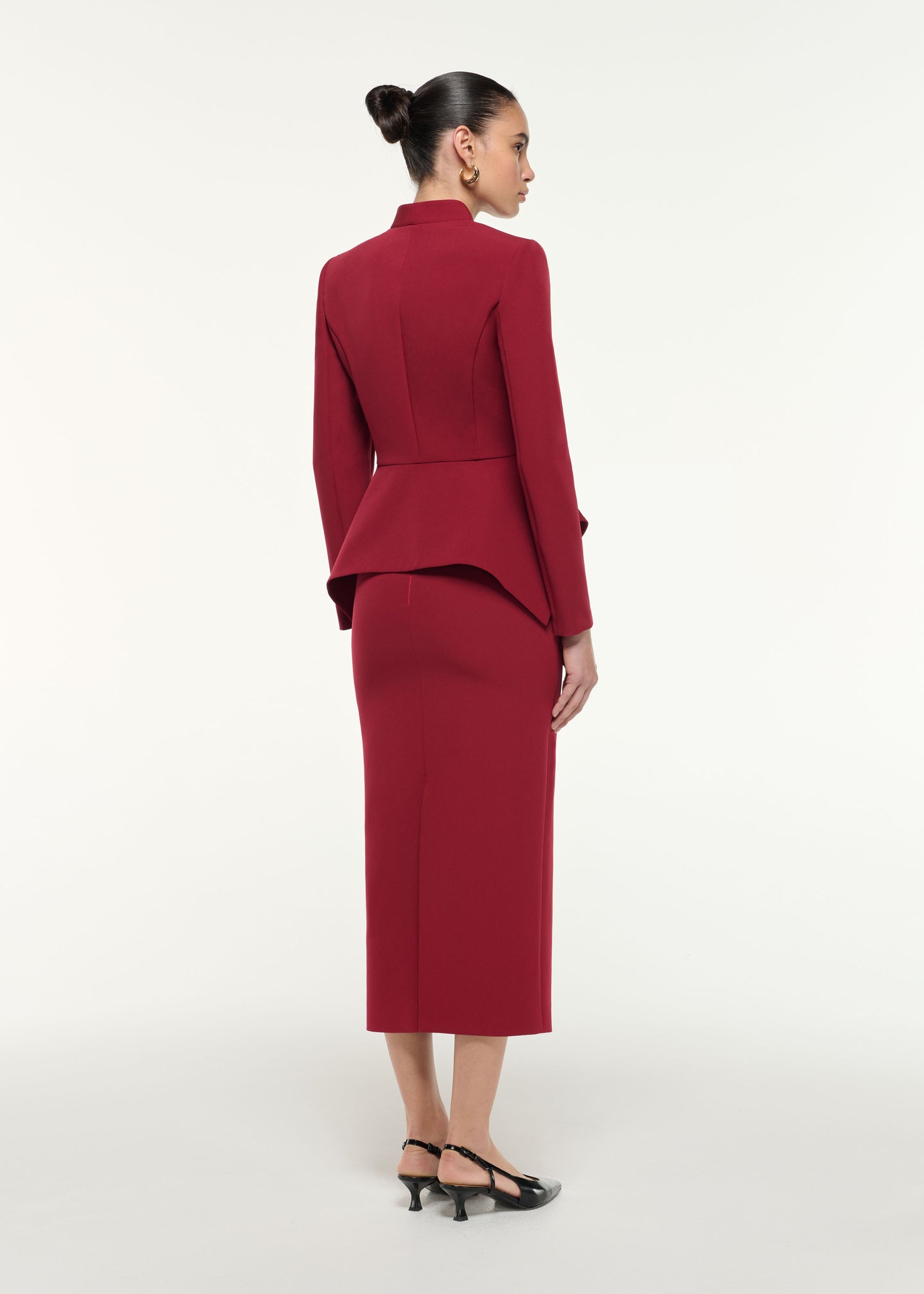 Back view of a model wearing the Light Crepe Midi Skirt in Dark Red