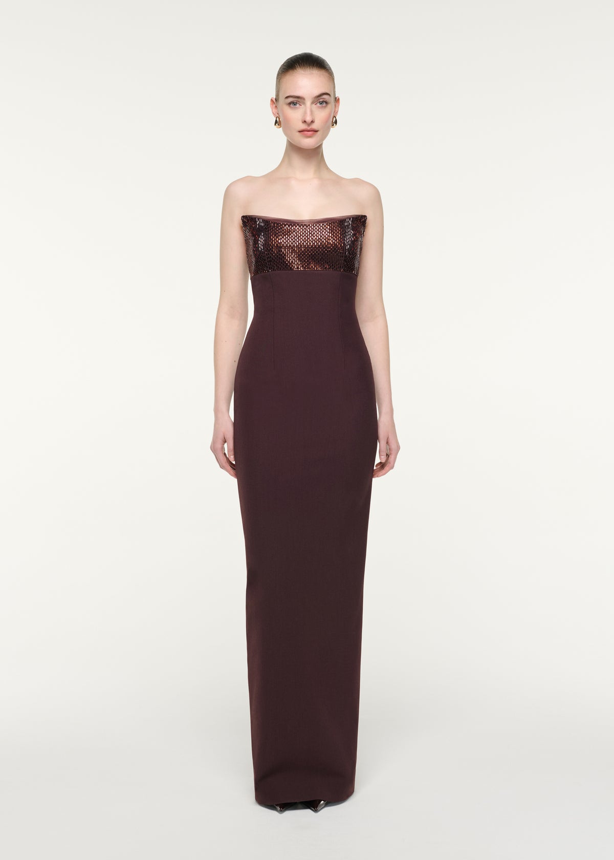 Front view of a model wearing the Strapless Diamate Panel Gown